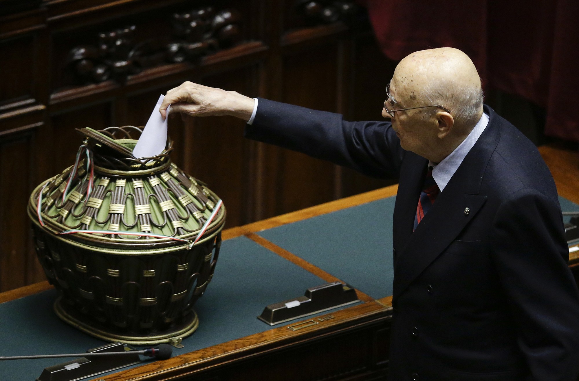 Former Italian President Giorgio Napolitano casts his vote Saturday at the lower chamber during a voting session for the election of the new Italian president in Rome.