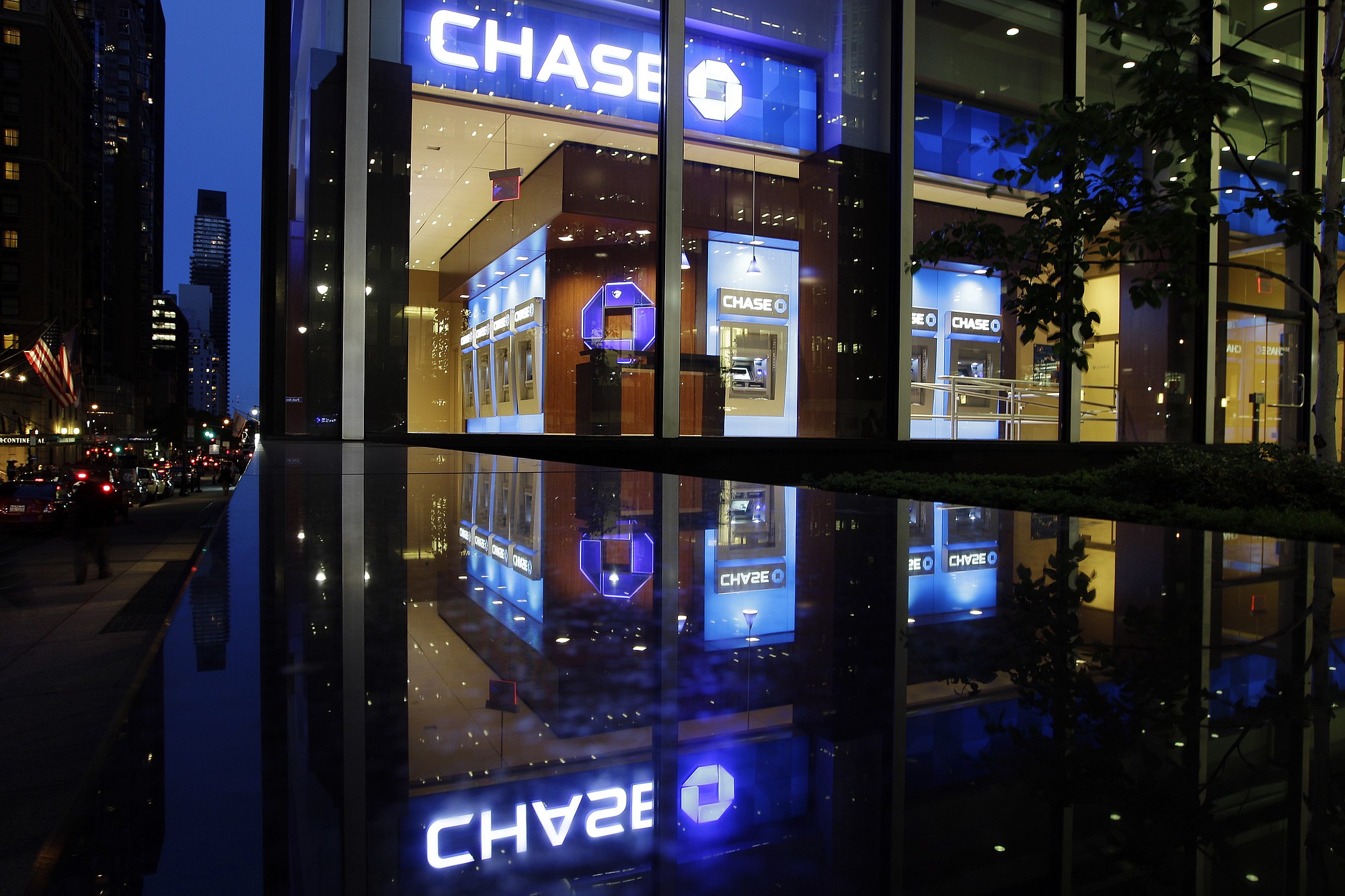 Cars pass a JP Morgan Chase building in New York.