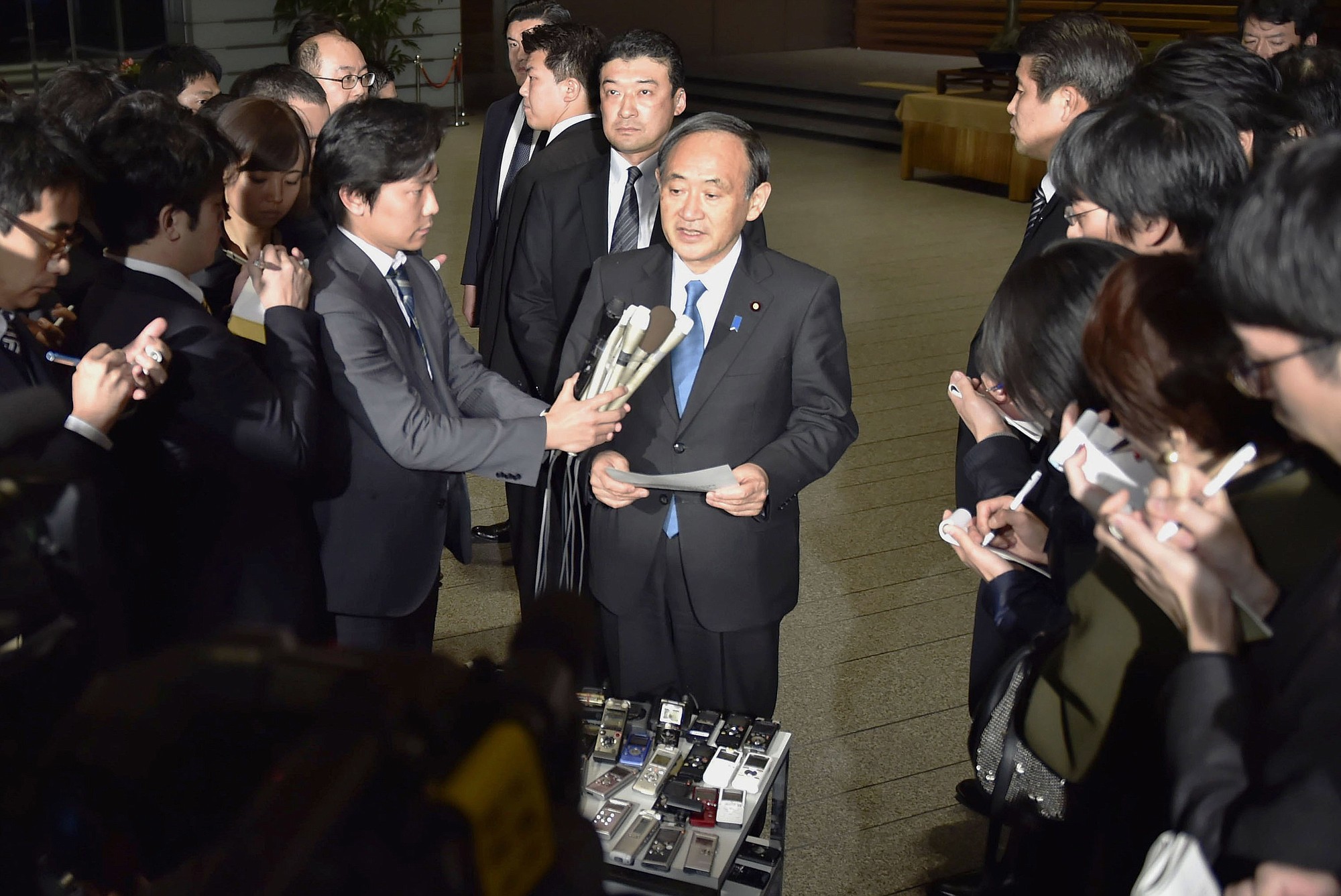 Japan's government spokesman Chief Cabinet Secretary Yoshihide Suga speaks to the media at the prime minister's office in Tokyo on Wednesday shortly after the latest online message purportedly from the Islamic State group warmed that Japanese hostage Kenji Goto and a Jordanian pilot the extremists hold have less than &quot;24 hours left to live.&quot;