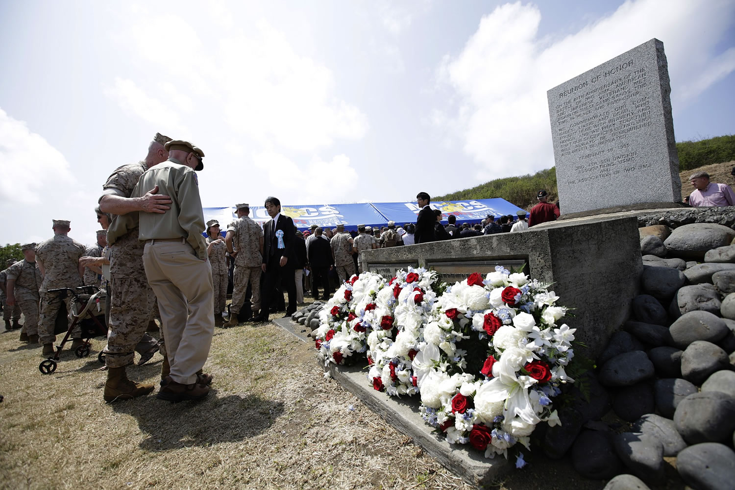 A U.S. Marine looks out at Invasion Beach near the site of a ceremony commemorating the 70th anniversary of the Battle of Iwo Jima, now known as Ioto, Japan, on Saturday, March 21, 2015. The battle is one of WWII's bloodiest and most iconic battles.