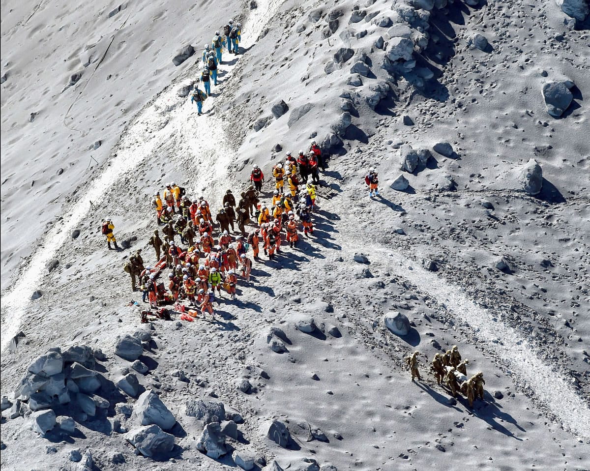 Rescuers conduct a search operation near the peak of Mount Ontake in central Japan on Wednesday.