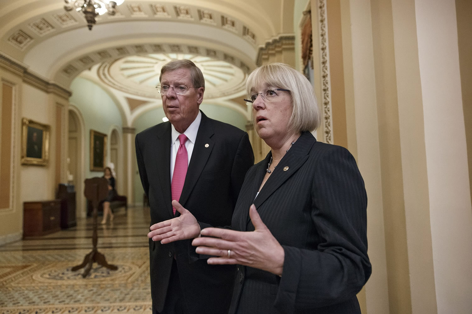 Sen. Johnny Isakson, R-Ga., left, and Sen. Patty Murray, D-Wash., meet before walking into the Senate chamber on Capitol Hill in Washington on Wednesday.
