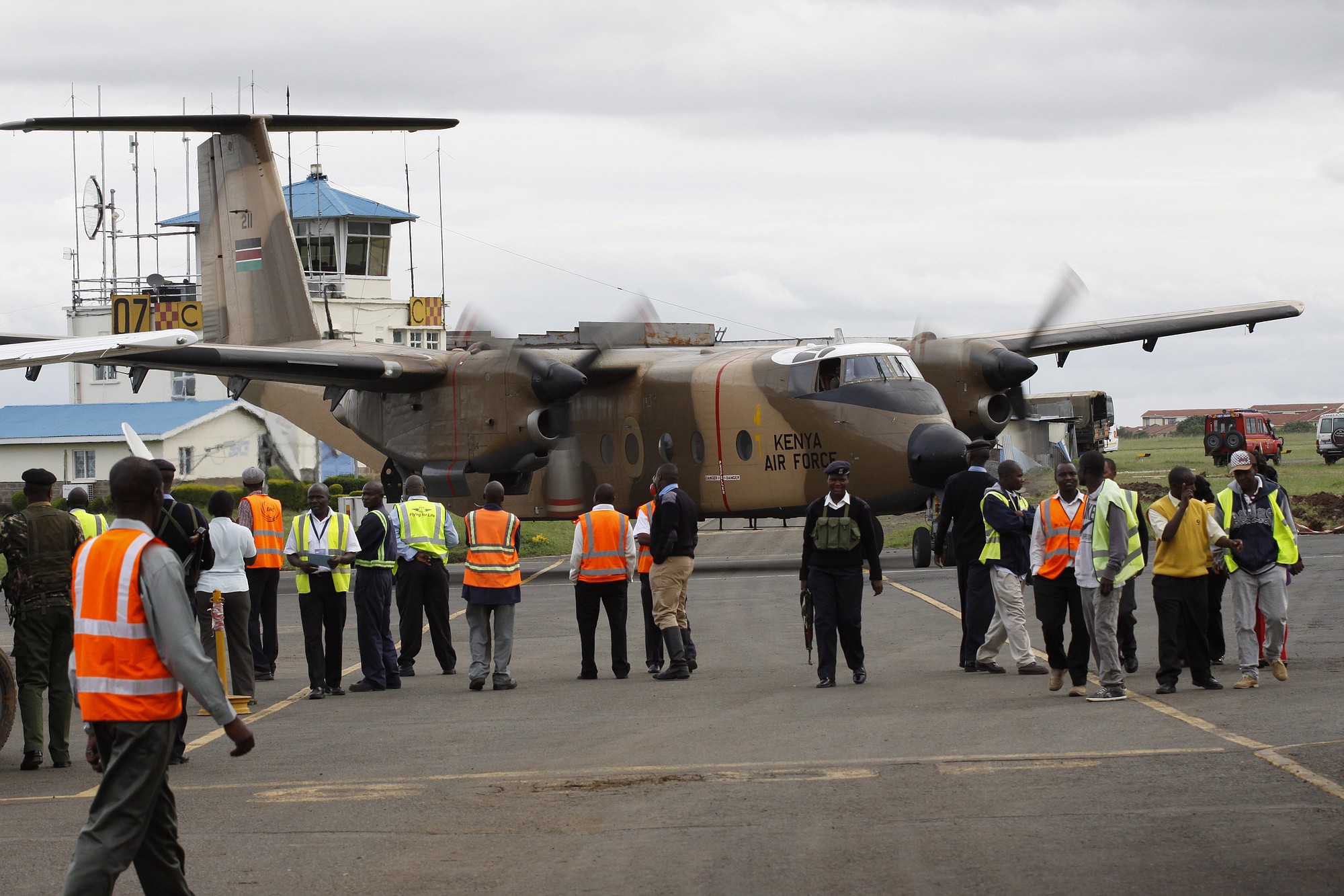 A Kenyan military aircraft carrying some of the bodies of those killed in the Mandera quarry attack, arrives at Wilson Airport in Nairobi, Kenya, on Tuesday.