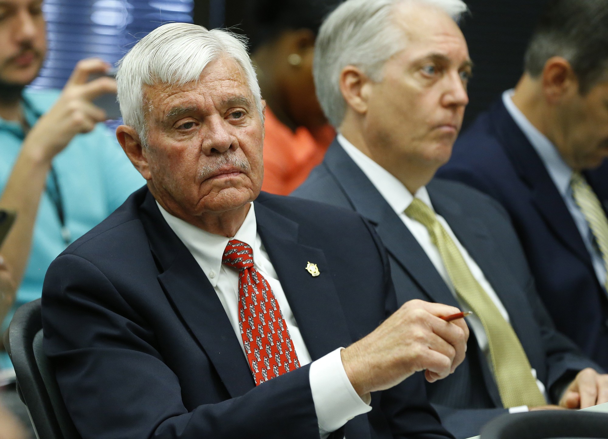 Tulsa County Sheriff Stanley Glanz listens to July 13  proceedings of a county commissioners meeting in Tulsa, Okla.