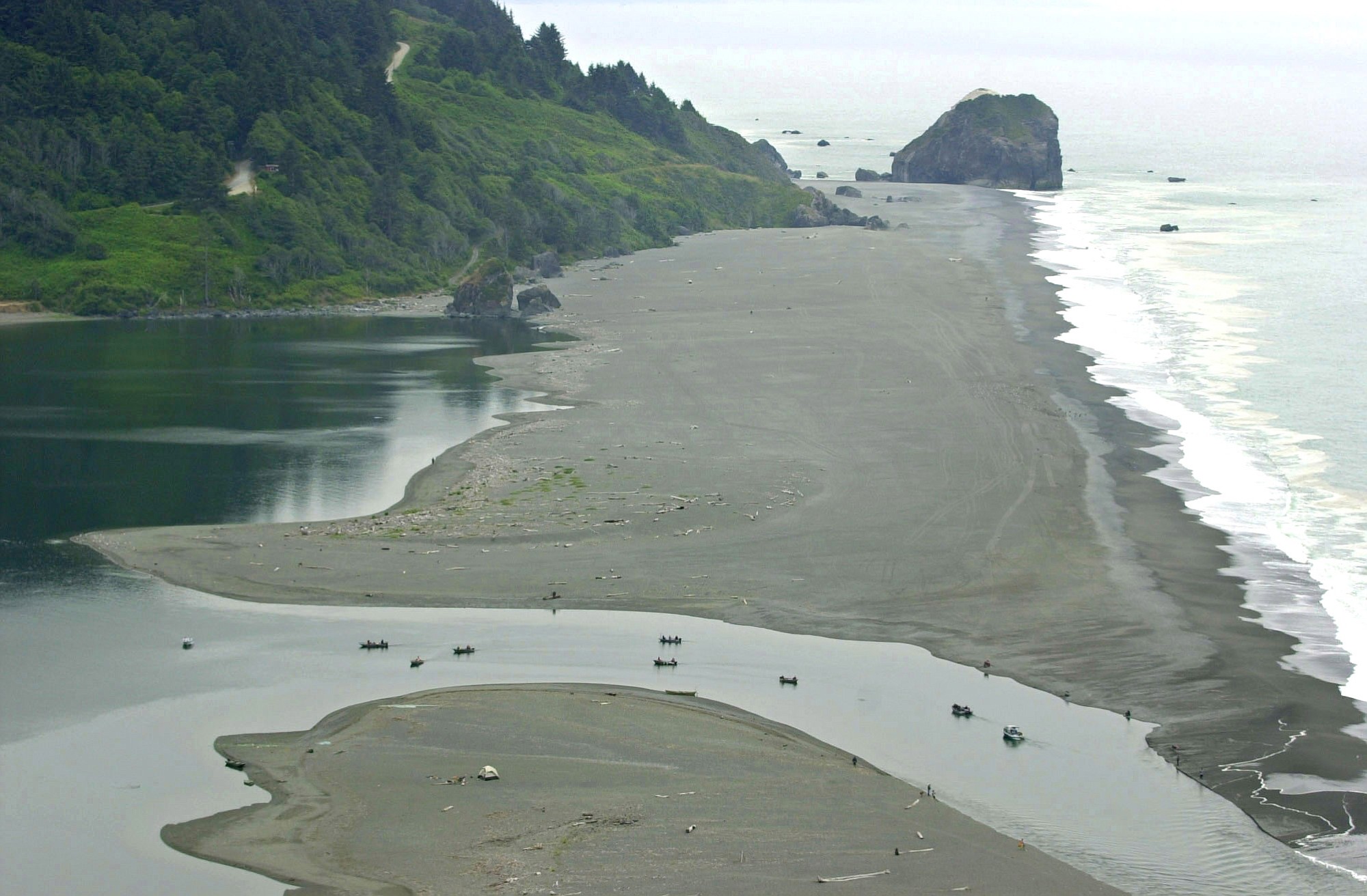 Associated Press files
Fishing boats float July 23, 2002, in the mouth of the Klamath River as it empties into the Pacific Ocean near Klamath, Calif. Deadly salmon parasites are thriving in the river, infecting nearly all the juvenile chinook salmon waiting to migrate to the ocean.