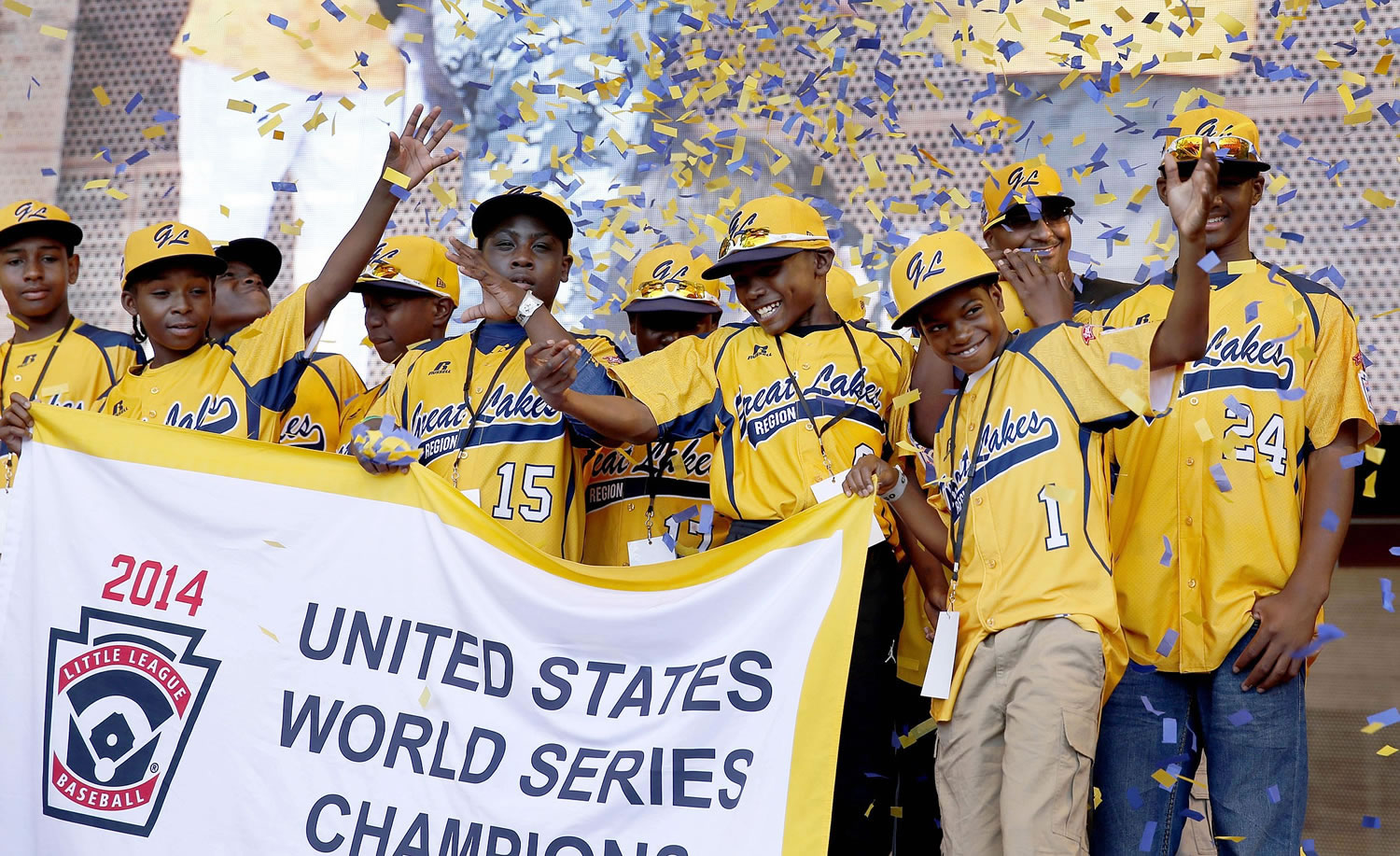 Members of the Jackie Robinson West Little League baseball team participate in a rally on Aug. 27, 2014, celebrating the team's U.S. Little League Championship in Chicago. Little League International has since stripped Chicago's Jackie Robinson West team of its national title.