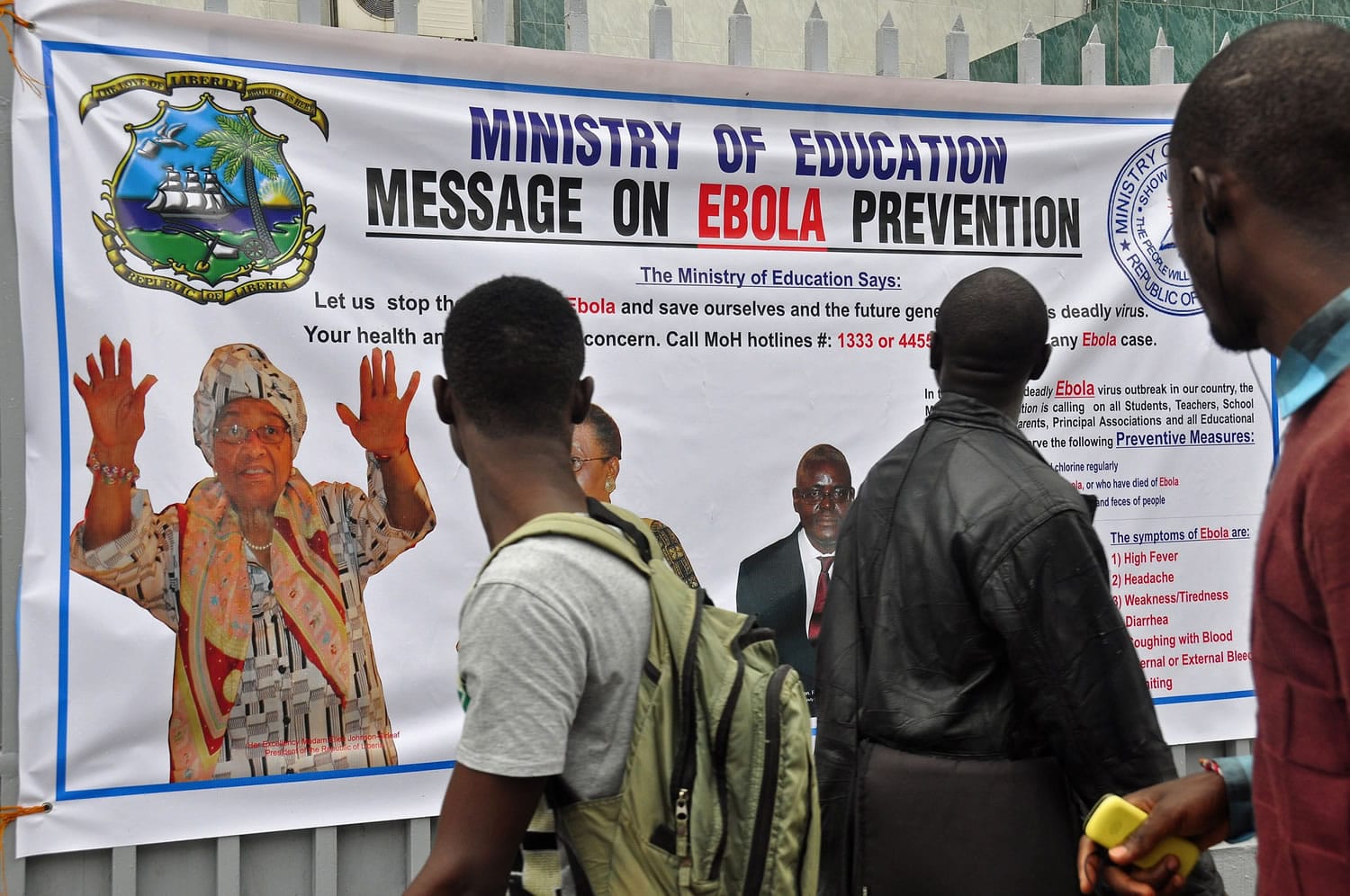 The image of Liberia President Ellen Johnson Sirleaf, left, appears on a banner Friday warning people about the Ebola virus in the city of Monrovia, Liberia. Over the decades, Ebola cases have been confirmed in 10 African countries, including Congo where the disease was first reported in 1976.