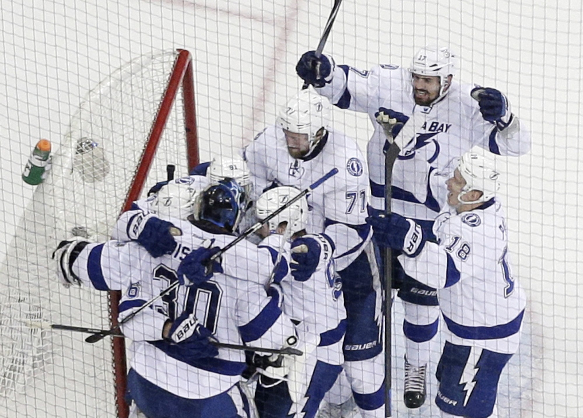 The Tampa Bay Lightning celebrate their 2-0 win over the New York Rangers in Game 7 of the Eastern Conference final, Friday, May 29, 2015, in New York.