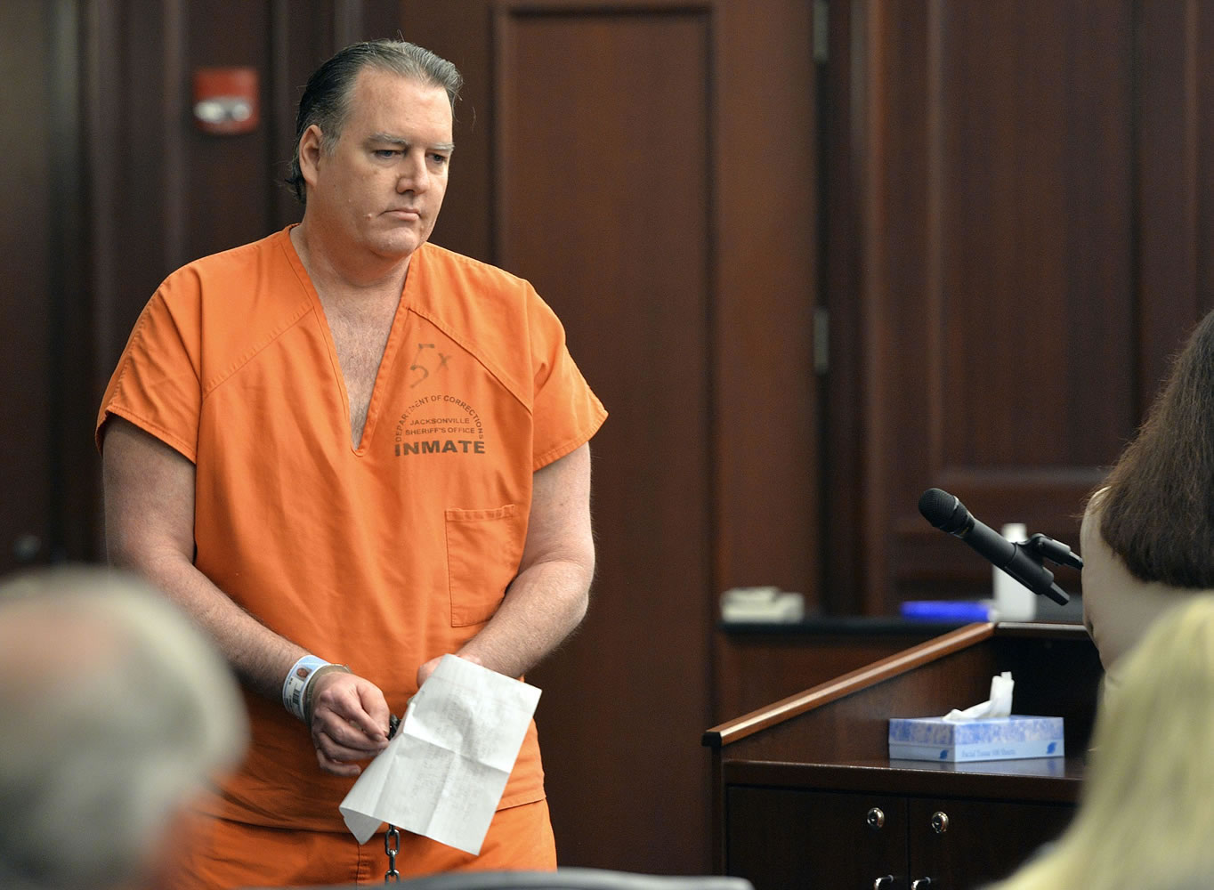 Michael Dunn returns to his seat after reading a statement, which included an apology to the victim's family, during his sentencing hearing Friday in Jacksonville, Fla.