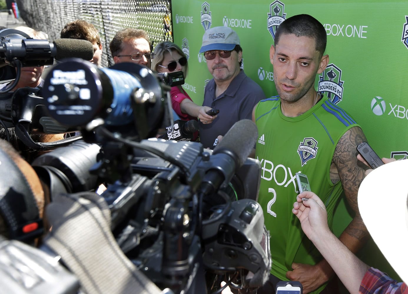 Seattle Sounders' Clint Dempsey talks to reporters following a training session, Friday, July 11, 2014, in Tukwila, Wash. It was Dempsey's first day back training with the Sounders after his time with the U.S. Men's National Team at the World Cup in Brazil. (AP Photo/Ted S.