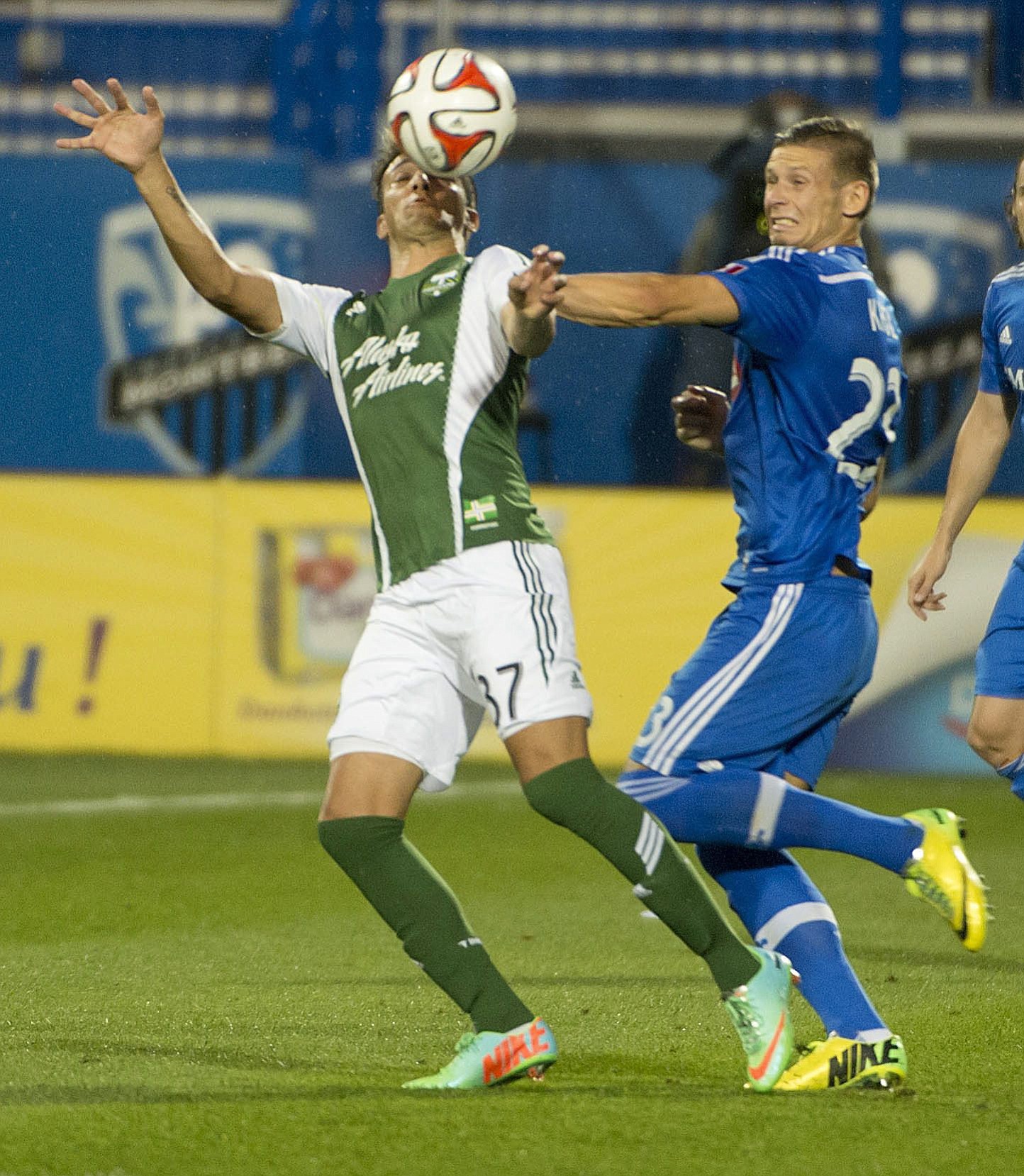 Portland Timbers' Maximiliano Urruti, left, and Montreal Impact's Krzysztof Krol vie for the ball during the first half of an MLS soccer game Sunday, July 27, 2014, in Montreal.