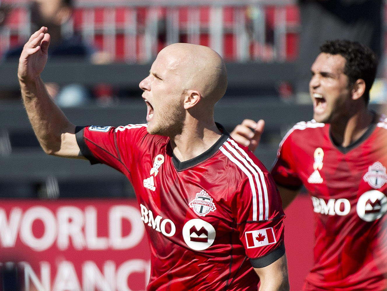 Toronto FC midfielder Michael Bradley, left, reacts after scoring the game winning goal during the second half  against the Portland Timbers in Toronto, Saturday, Sept. 27, 2014. Toronto won 3-2.