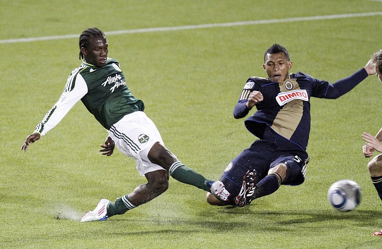 Portland Timbers midfielder Diego Chara, left, takes a shot on goal against Philadelphia Union defender Carlos Valdes during the second half of an MLS soccer game in Portland on Friday.