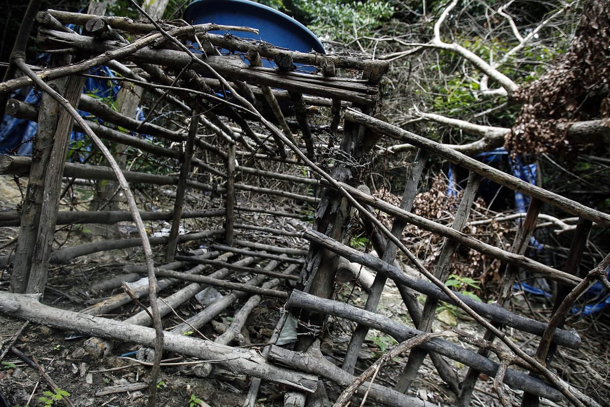An abandoned cage is shown Tuesday at a camp used by human traffickers at the Malaysia-Thailand border.