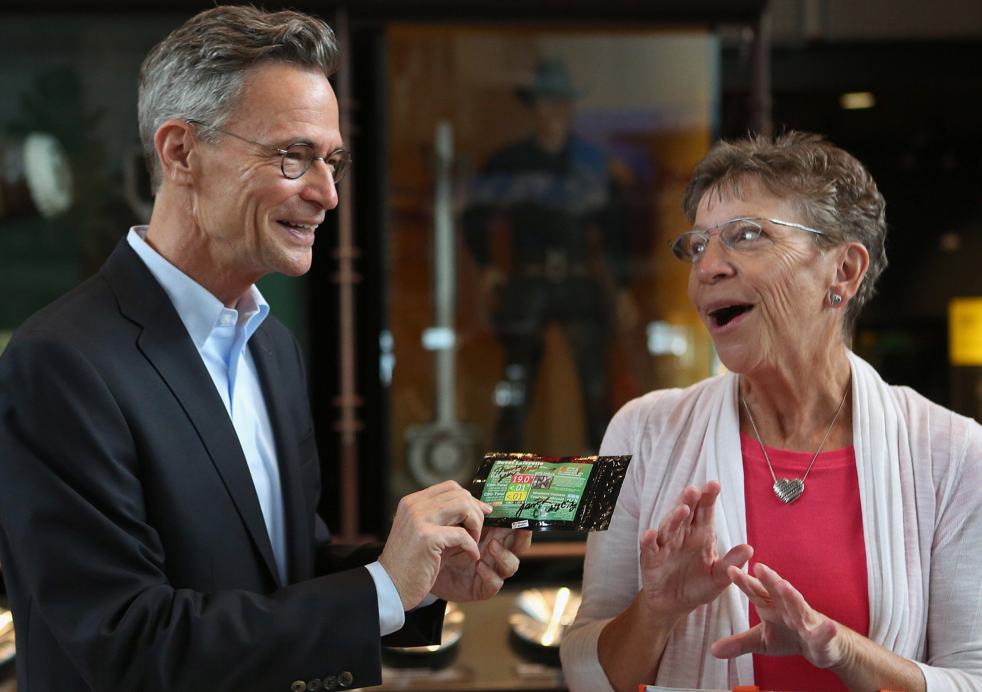 Leonard Garfield, executive director of Seattle's Museum of History and Industry, holds two grams of pot, part of Seattle's first legal pot purchase that Greene donated to the museum Tuesday.