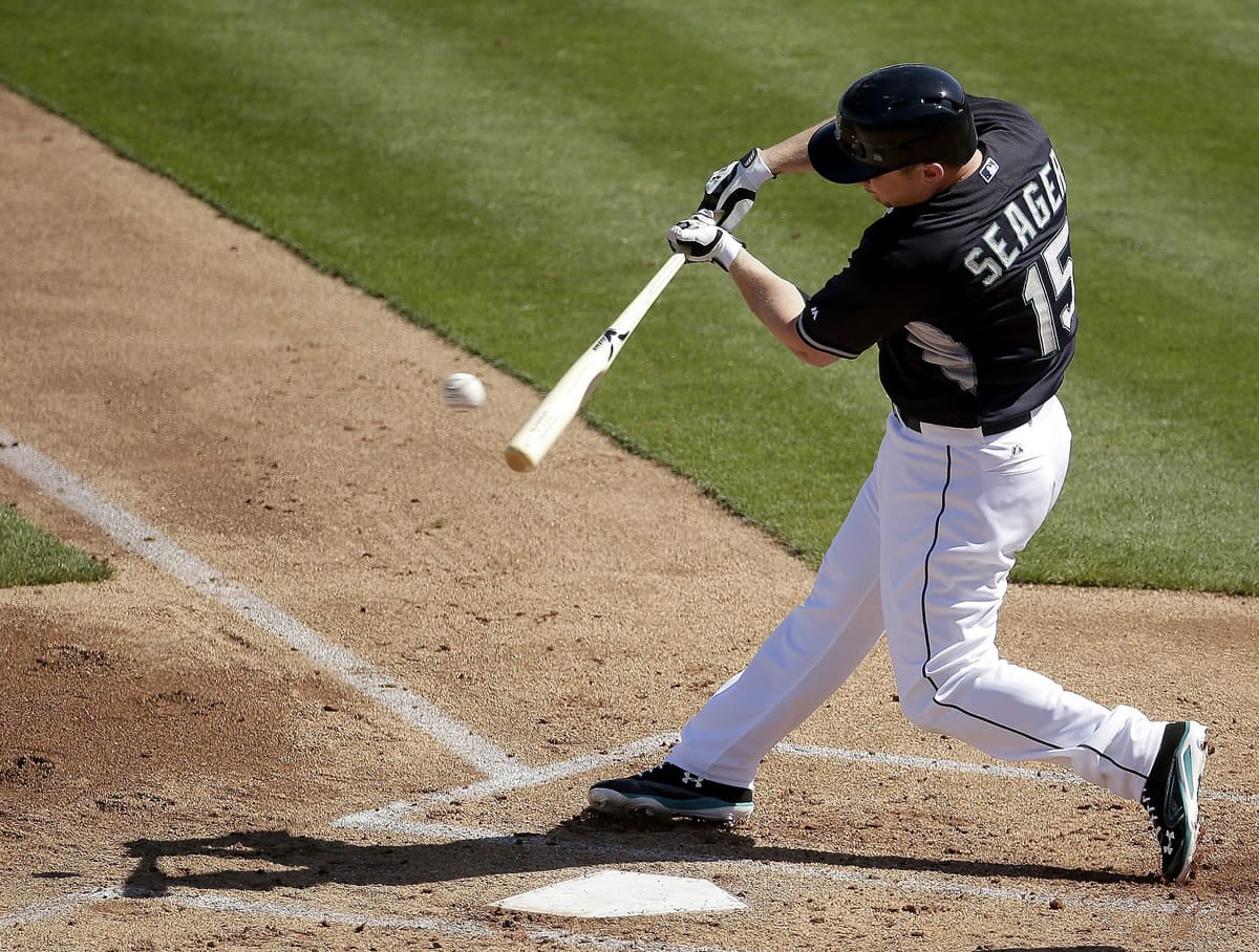 Seattle Mariners' Kyle Seager hit a home run Sunday against the Texas Rangers, a day after sitting out due to tightness in his side.