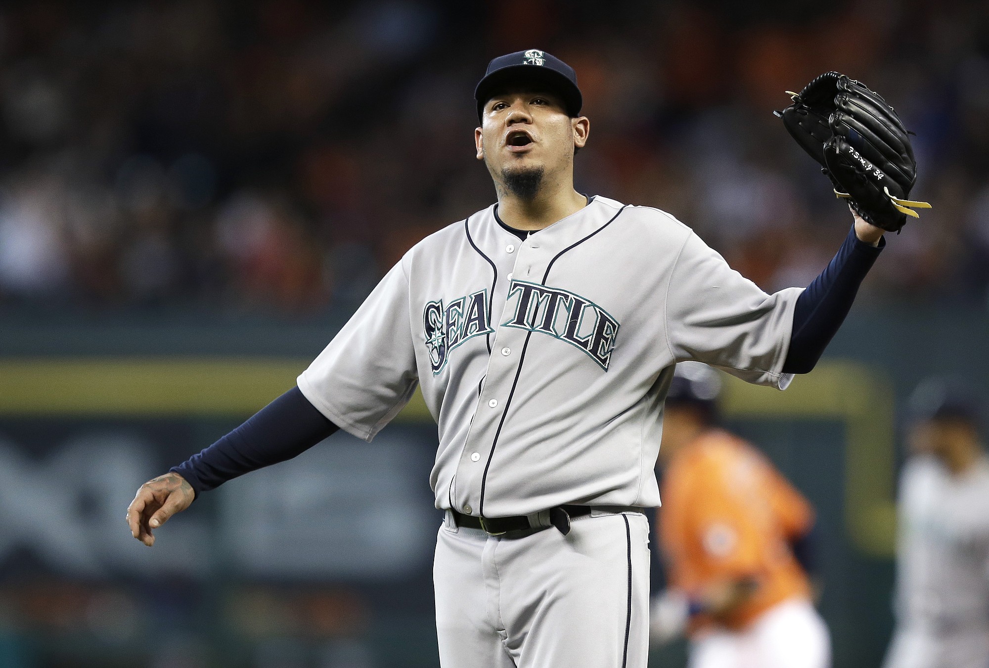 Seattle Mariners starting pitcher Felix Hernandez yells as Houston Astros' Jason Castro, background, rounds the bases on a two-run home run during the first inning Friday, June 12, 2015, in Houston. Hernandez pitched one-third inning giving up five hits and eight runs.