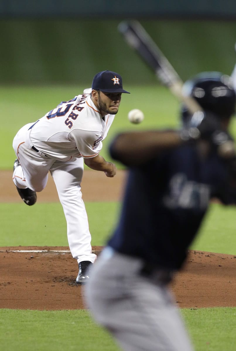 Houston Astros' Lance McCullers, left, delivers a pitch to Seattle Mariners' Austin Jackson in the first inning Sunday, June 14, 2015, in Houston.