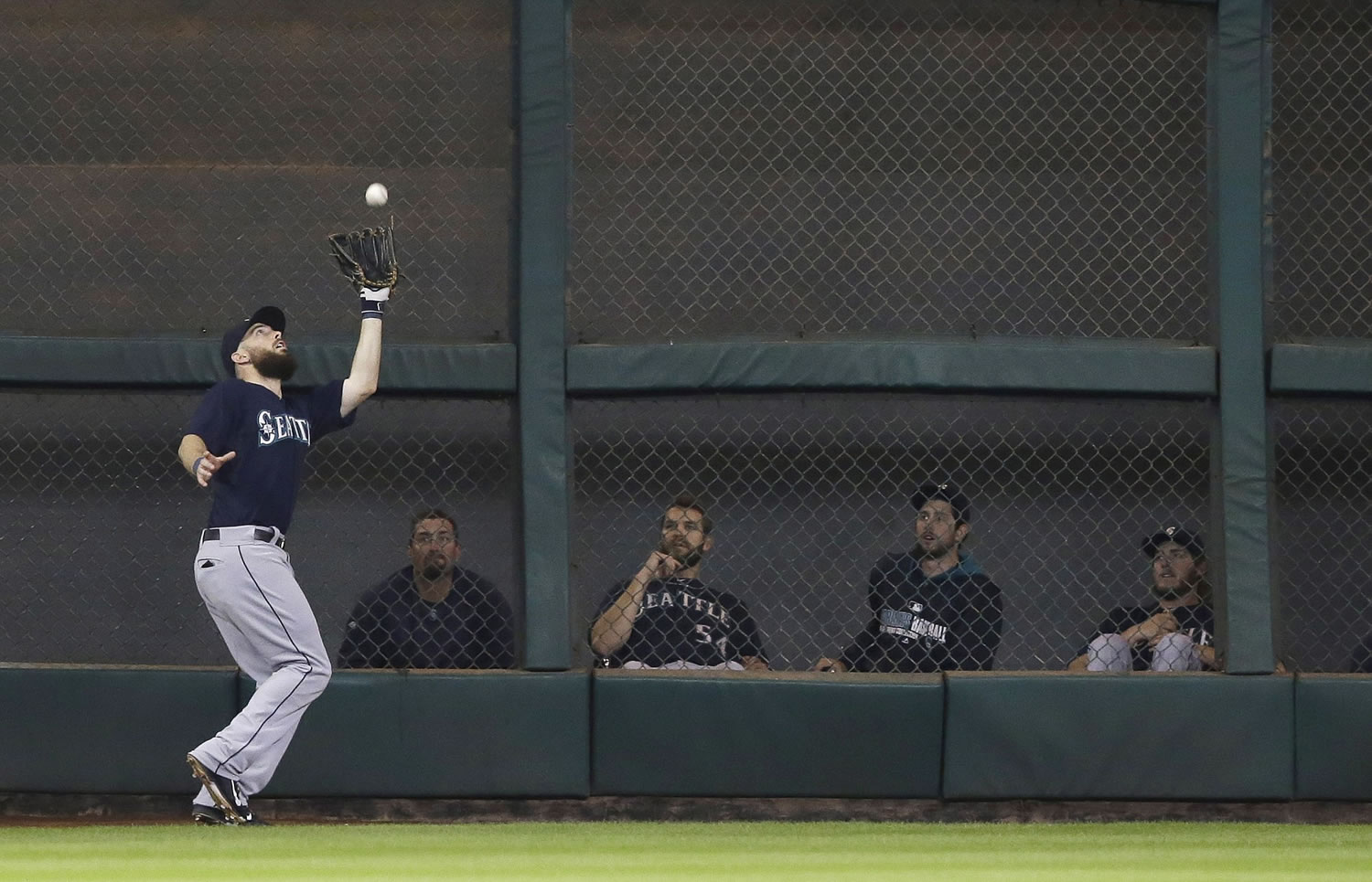 Seattle Mariners left fielder Dustin Ackley makes a catch in front of the bullpen for an out on Houston Astros' Jason Castro in the fourth inning Tuesday in Houston.