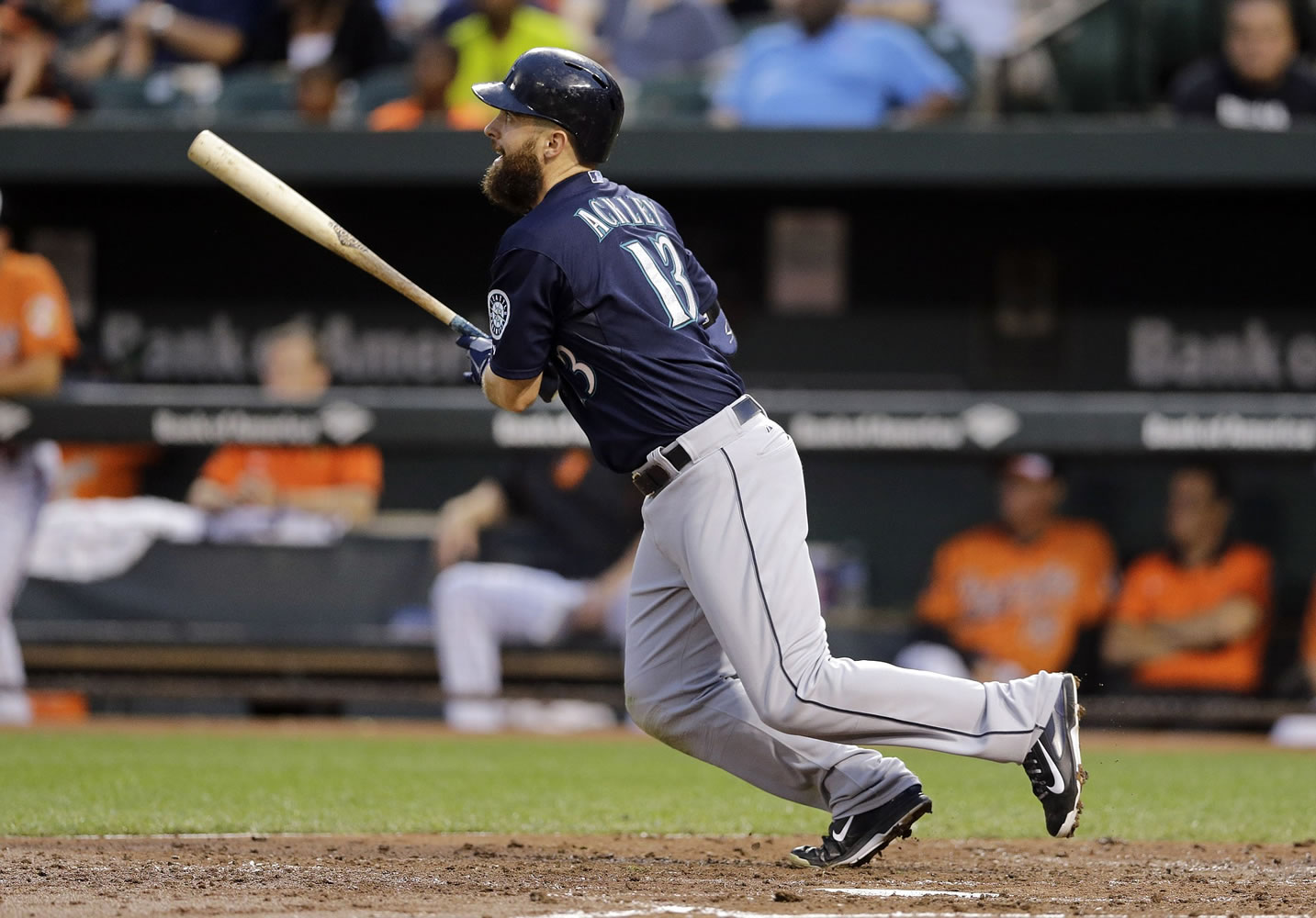 Seattle Mariners' Dustin Ackley watches his solo home run in the third inning against the Baltimore Orioles, Saturday, Aug. 2, 2014, in Baltimore.