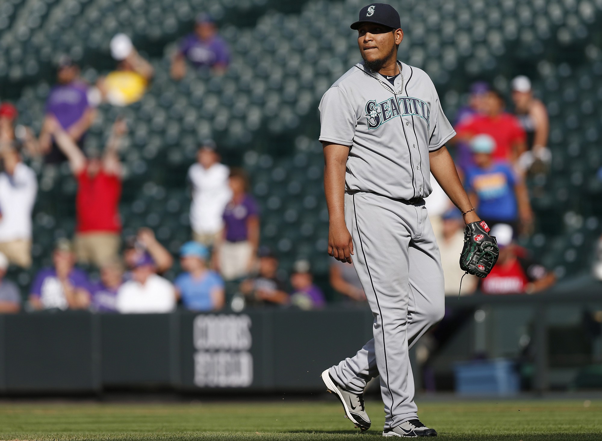 Seattle Mariners relief pitcher Mayckol Guaipe watches a two-run home run that he gave up to Colorado Rockies' Michael McKenry during the 11th inning of a baseball game Wednesday, Aug. 5, 2015, in Denver. Colorado won 7-5 in 11 innings.