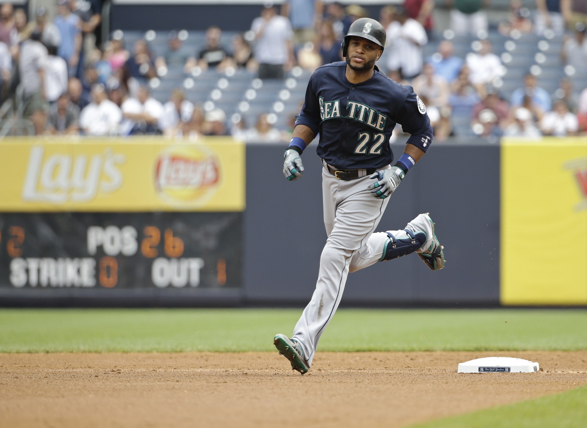 Seattle Mariners' Robinson Cano (22) runs the bases after hitting a two run home run during the first inning against the New York Yankees on Saturday, July 18, 2015, in New York.