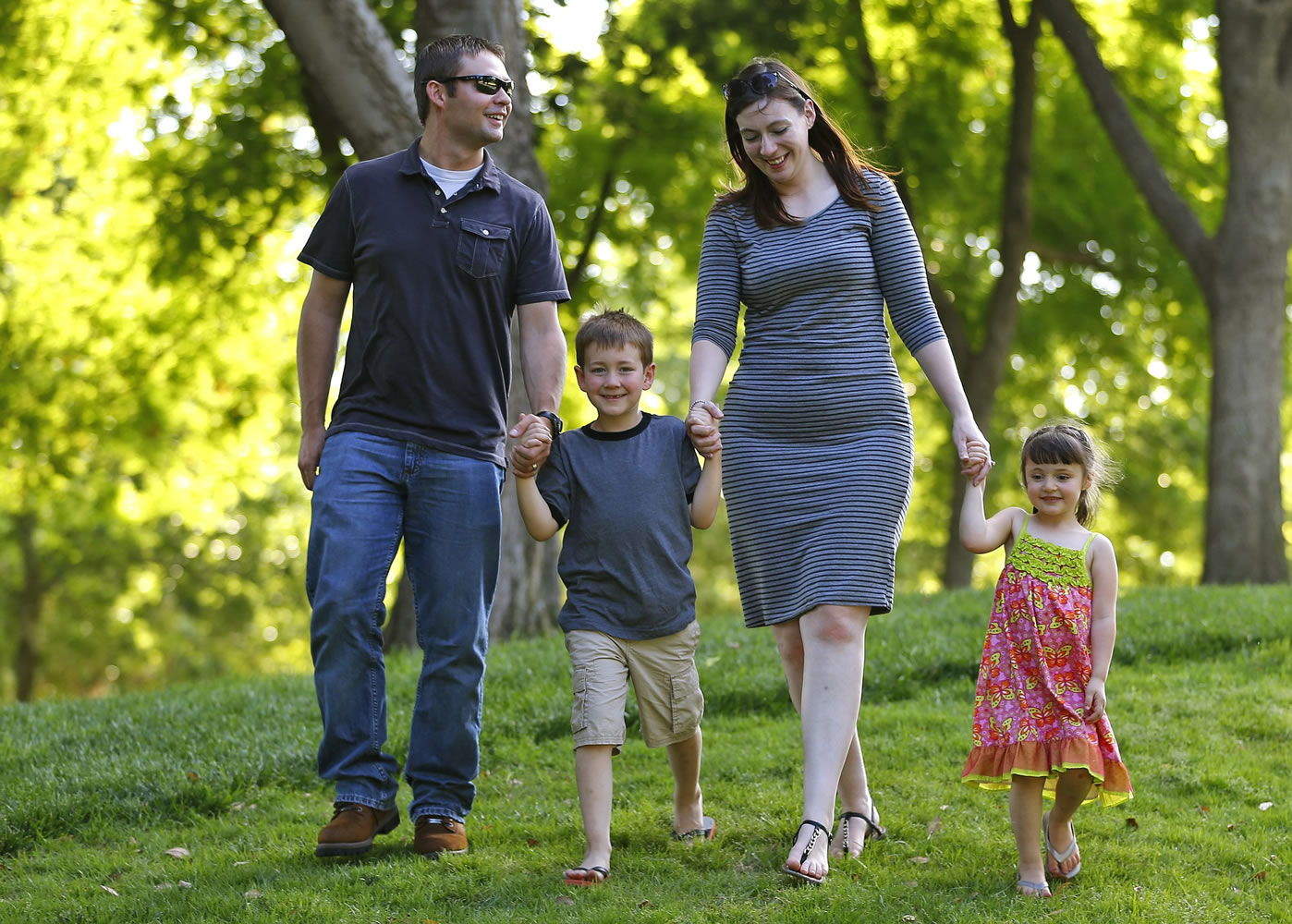 The Chudoba family, from  left, Chad, Isaac, Rachel and Alexandra, spend family time together as they walk through Myriad Gardens in Oklahoma City.