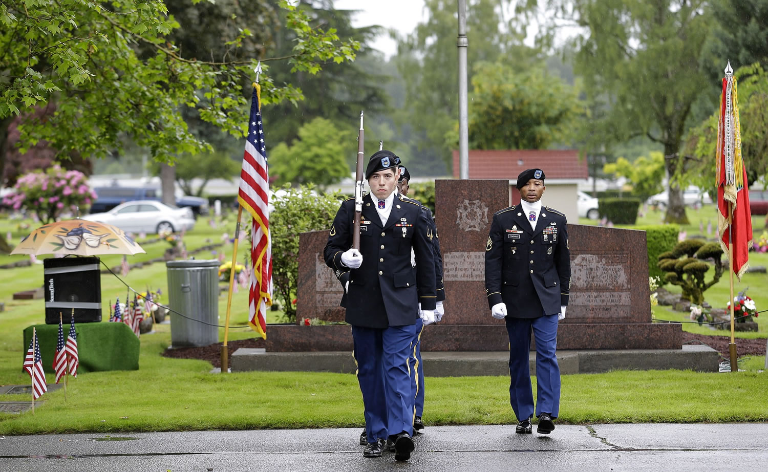 An honor guard from the 13th Combat Sustainment Support Battalion at Joint Base Lewis McChord takes part in a Memorial Day ceremony Monday at the Sumner Cemetery in Puyallup,.