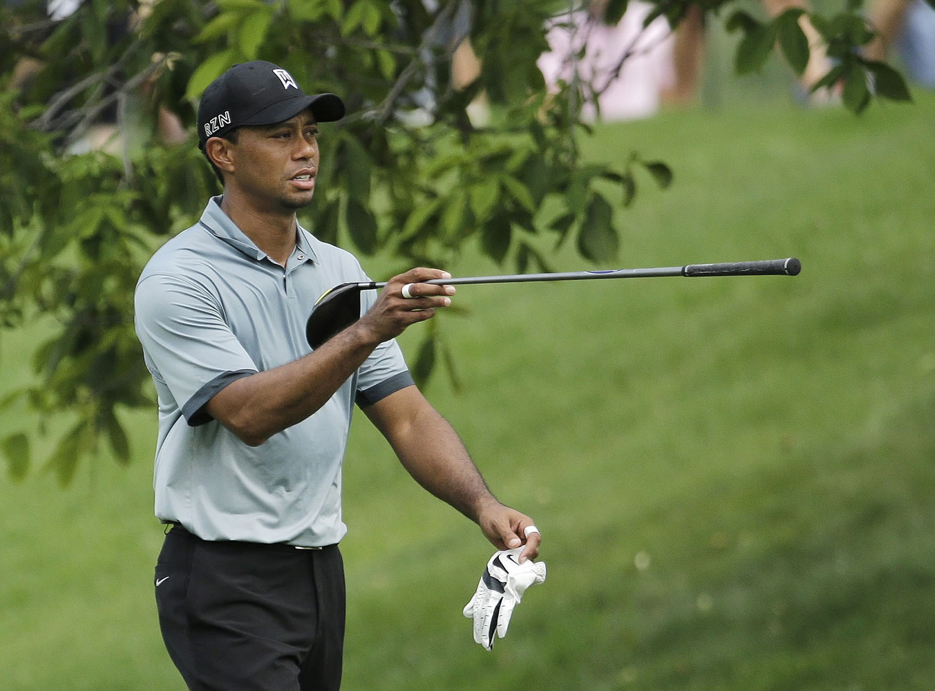 Tiger Woods points in the direction of his drive on the 11th hole during the second round of the Memorial golf tournament Friday in Dublin, Ohio.