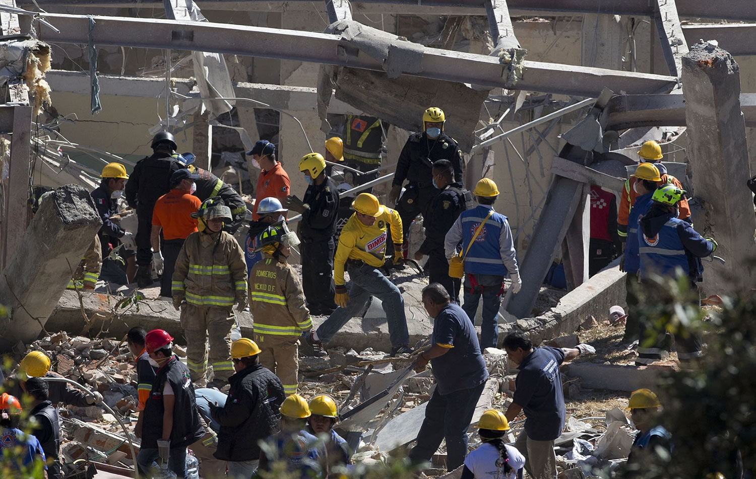 Rescue workers comb through the rubble of a children's hospital after a gas truck exploded, in Cuajimalpa on the outskirts of Mexico City, on Thursday.
