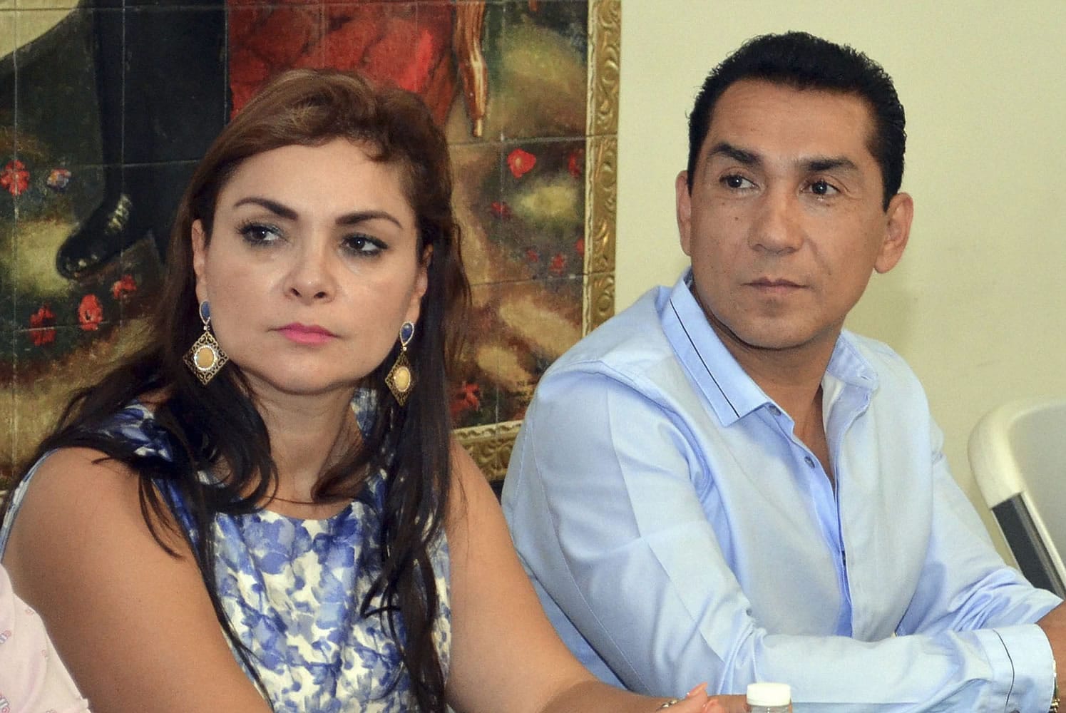 The mayor of the city of Iguala, Jose Luis Abarca, right, and his wife Maria de los Angeles Pineda Villa meet with state government officials in Chilpancingo, Mexico.