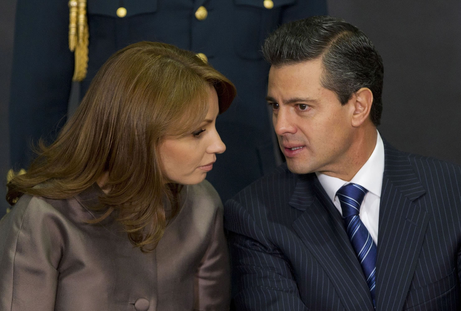 Mexico's President Enrique Pena Nieto, right, speaks to his wife Angelica Rivera as they attend a ceremony launching the program &quot;Life insurance for female heads of family&quot; at Los Pinos presidential residence in Mexico City.