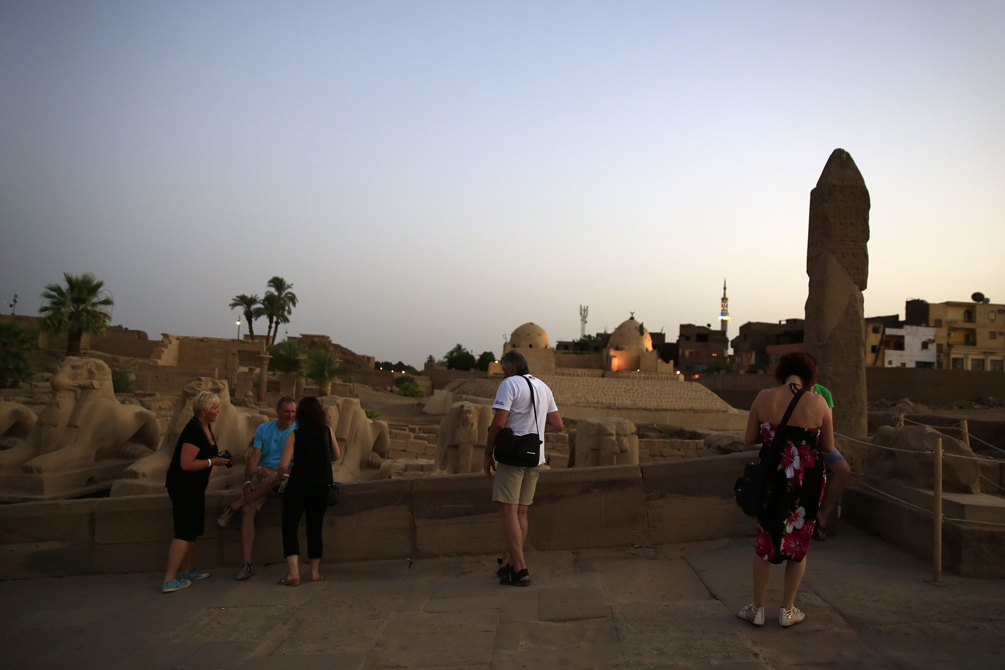 Tourists look out at the ruins of the Karnak Temple on Wednesday in Luxor, Egypt.