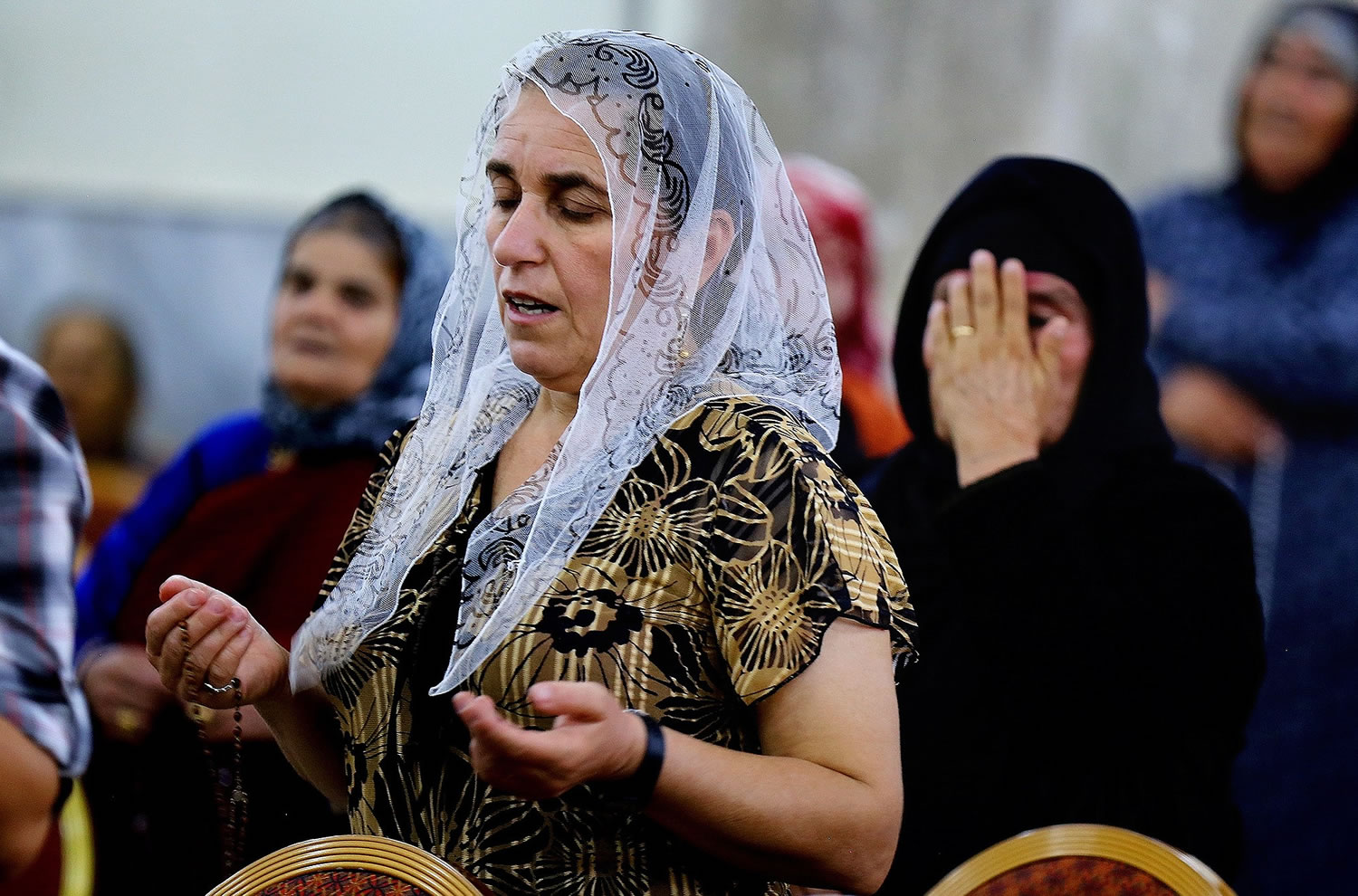 Displaced Christians who fled the violence in Mosul pray Saturday at Mar Aframa church in the town of Qaraqoush on the outskirts of Mosul. Iraq was home to an estimated 1 million Christians before the 2003 U.S.-led invasion that ousted Saddam Hussein.  Since then, militants have frequently targeted Christians across the country, bombing their churches and killing clergymen. Under such pressures, many Christians have left the country.