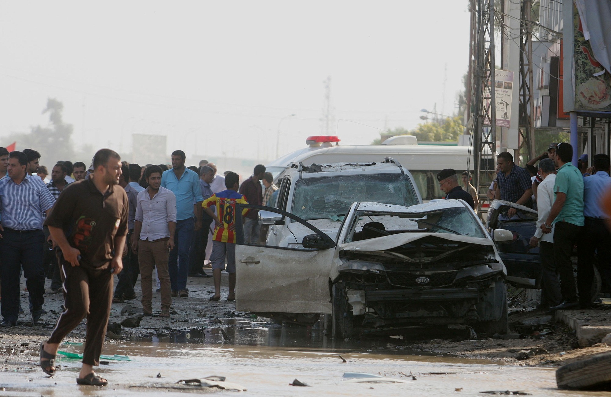 Associated Press
People gather Monday at the scene of a car bomb explosion in which people were killed and wounded in a commercial area in the southern Shiite holy city of Karbala, 55 miles south of Baghdad.