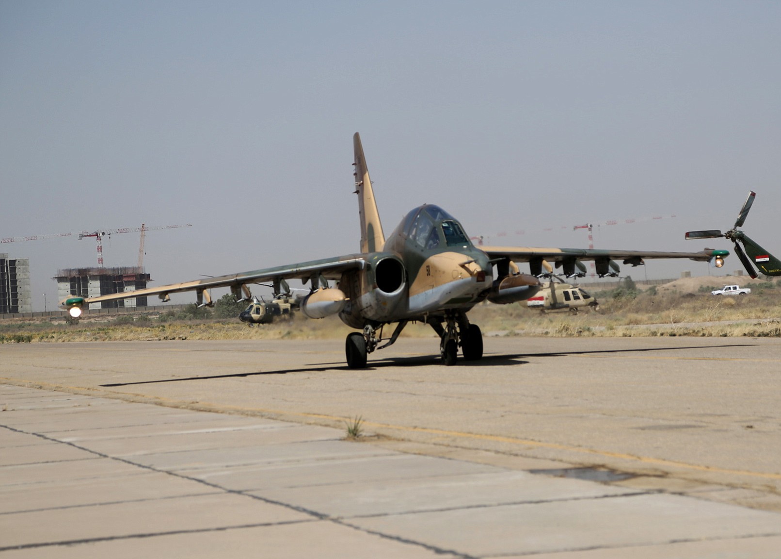 A Russian fighter jet arrives at al-Muthanna air base in Baghdad, Iraq, Tuesday, July 1, 2014. Iraq is increasingly turning to other governments like Iran, Russia and Syria to help beat back a rampant insurgency because it cannot wait for additional American military aid, Baghdad's top envoy to the U.S.
