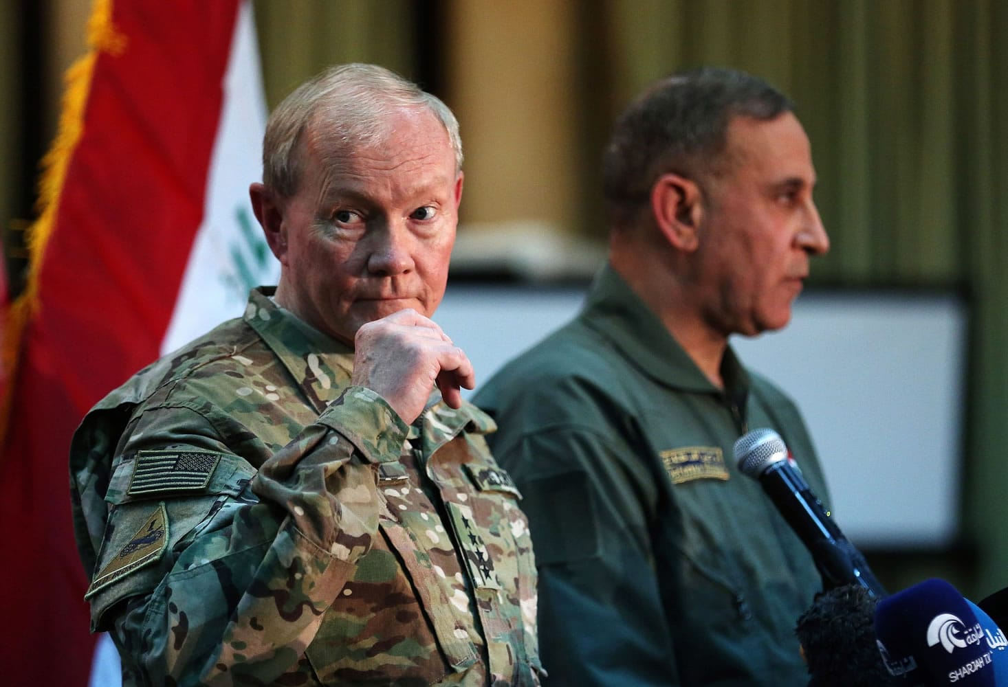Gen. Martin Dempsey, chairman of the U.S. Joint Chiefs of Staff, left, and Iraqi Defense Minister Khalid al-Obeidi address a press conference Monday at the Iraqi defense ministry headquarters in Baghdad, Iraq. The U.S. worries that Iran, a major U.S.