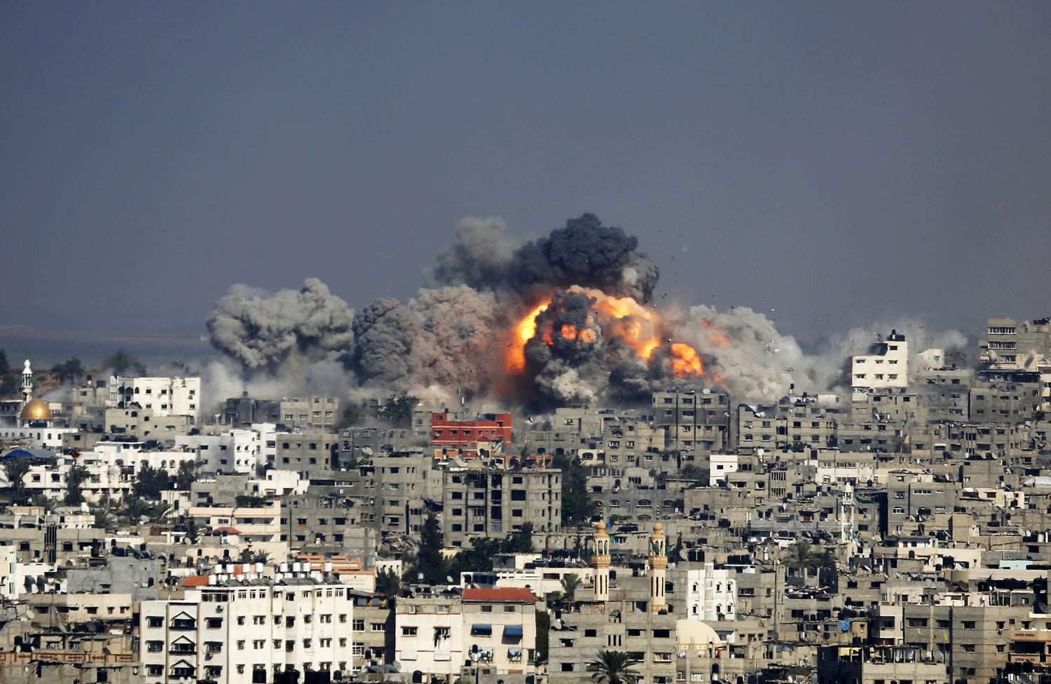 Smoke and fire from the explosion of an Israeli strike rise over Gaza City on  Tuesday.