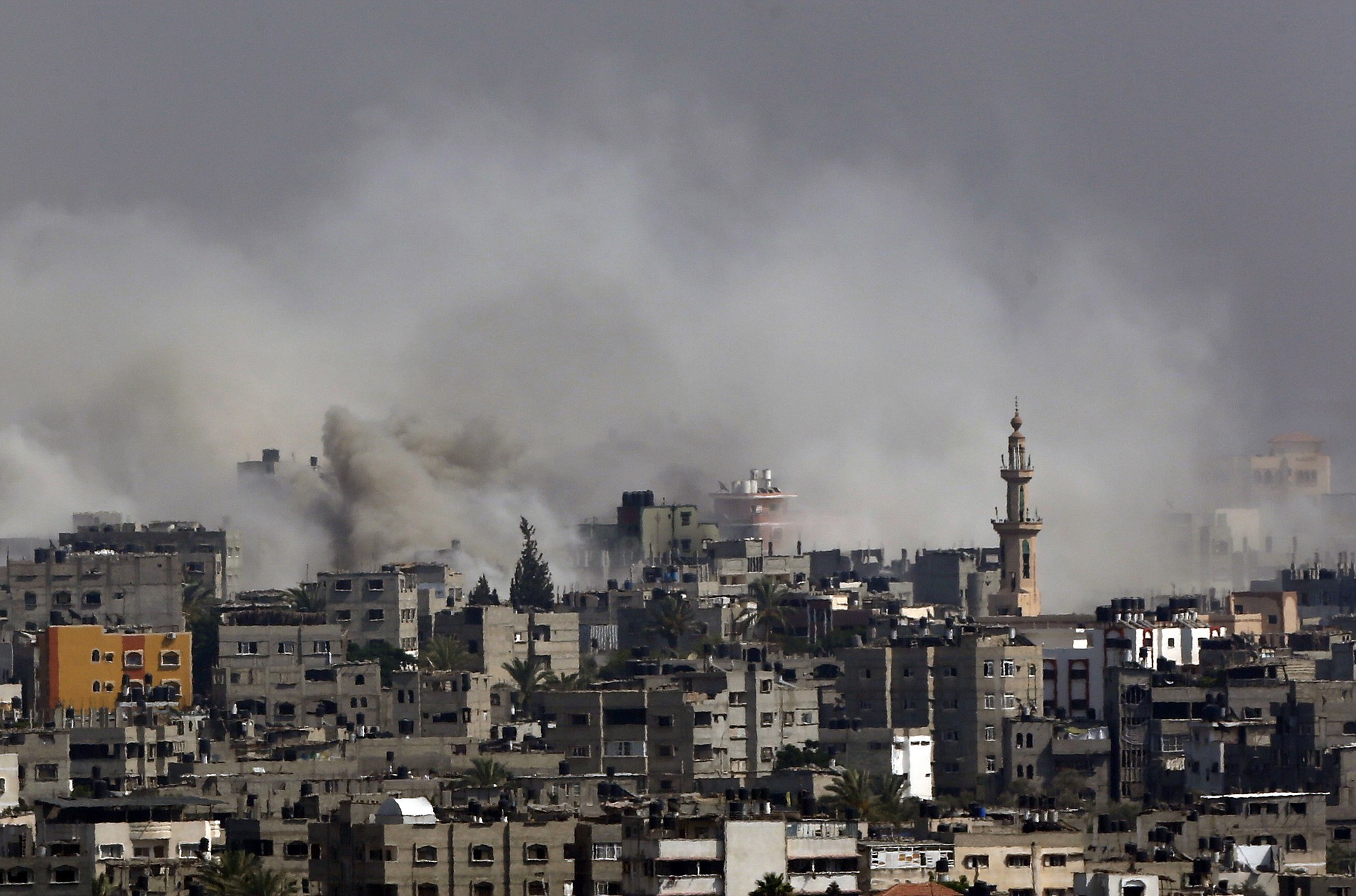 Smoke from Israeli strikes rises over Gaza City, in the Gaza Strip, on Monday. chief Ban Ki-moon and U.S. Secretary of State John Kerry were heading to Cairo on Monday to try to end the deadliest conflict between Israel and Gazau2019s Hamas rulers in just over five years.