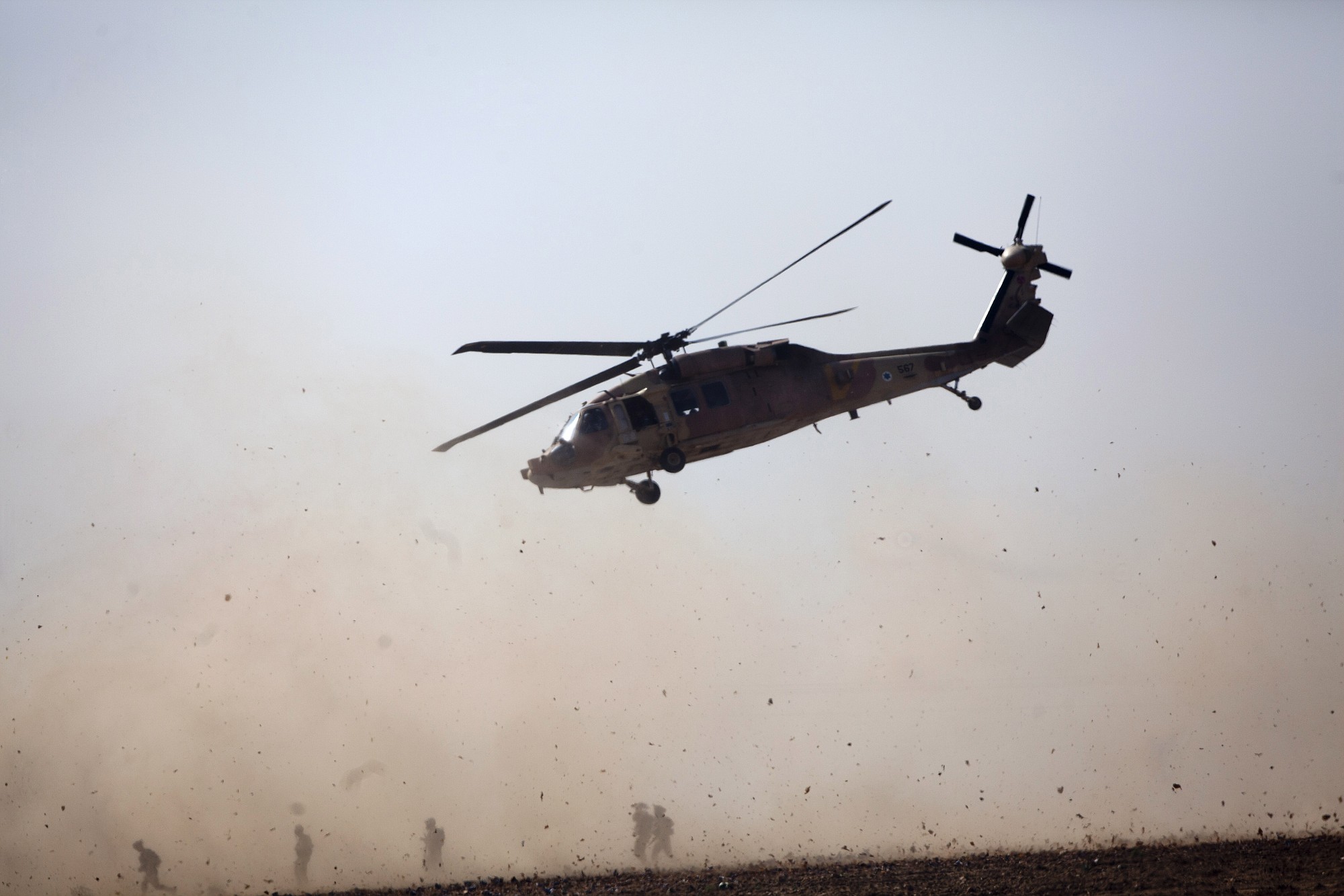 Israeli helicopter takes off with a wounded soldier near the Israel and Gaza border Thursday.