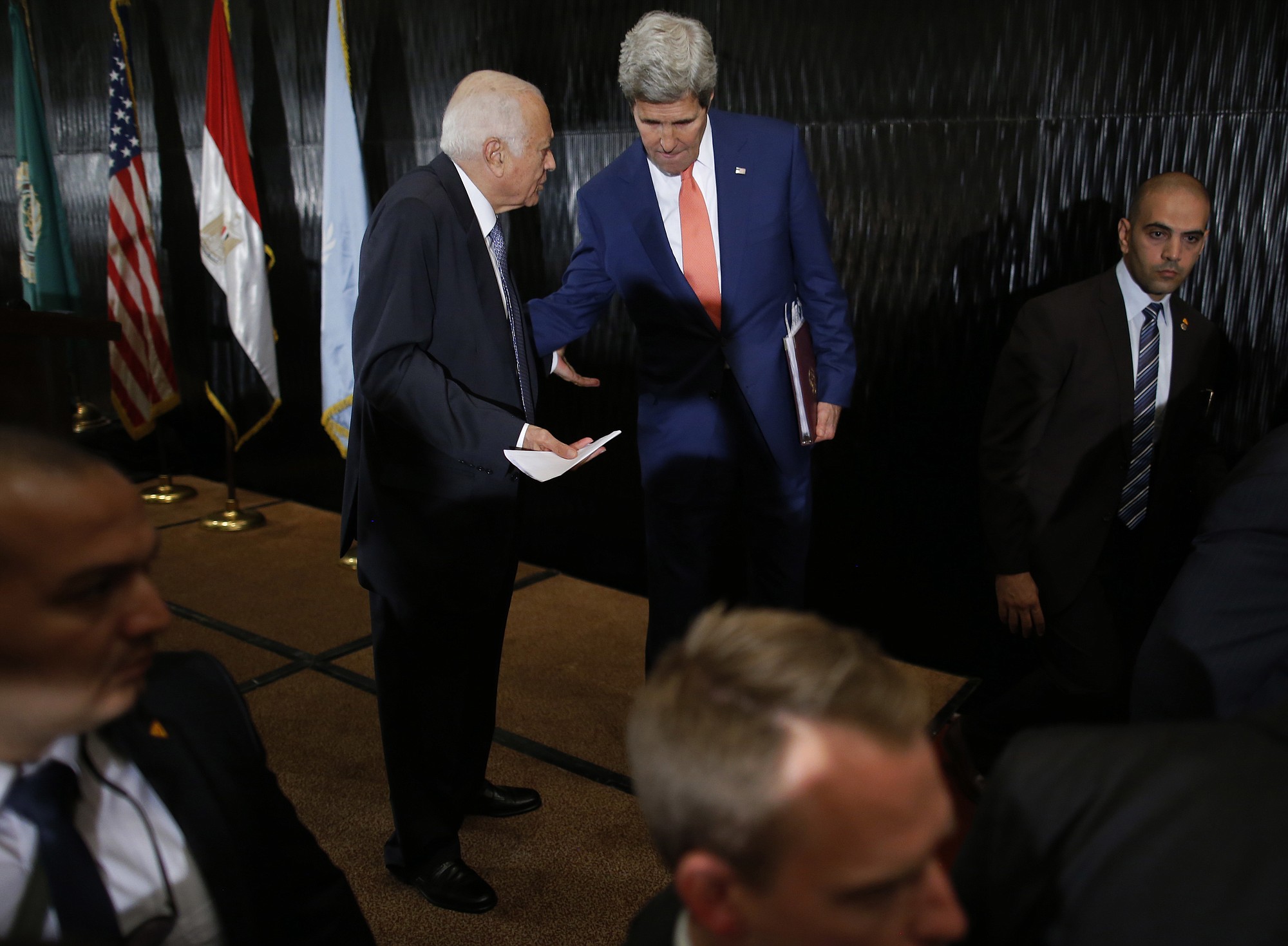 U.S. Secretary of State John Kerry, right, talks with Secretary-General of the Arab League Nabil al-Araby at the end of a news conference Friday in Cairo.