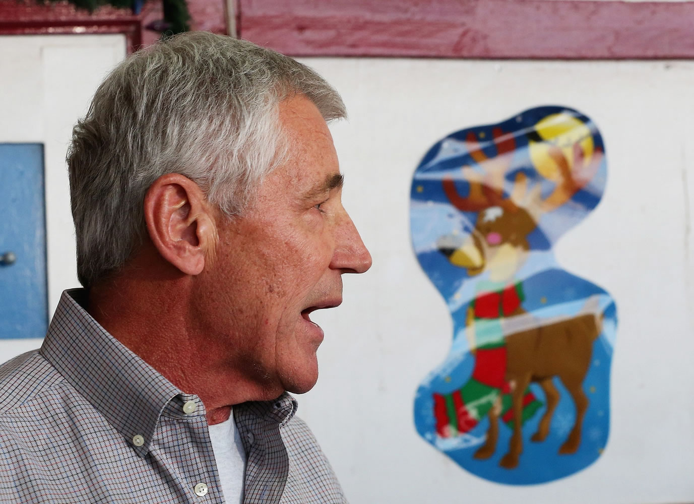 U.S. Secretary of Defense Chuck Hagel speaks during a press conference after visiting U.S. troops in Kuwait City, Monday, Dec. 8, 2014. Hagel visited the camp which once was a staging post for troops headed to Iraq.