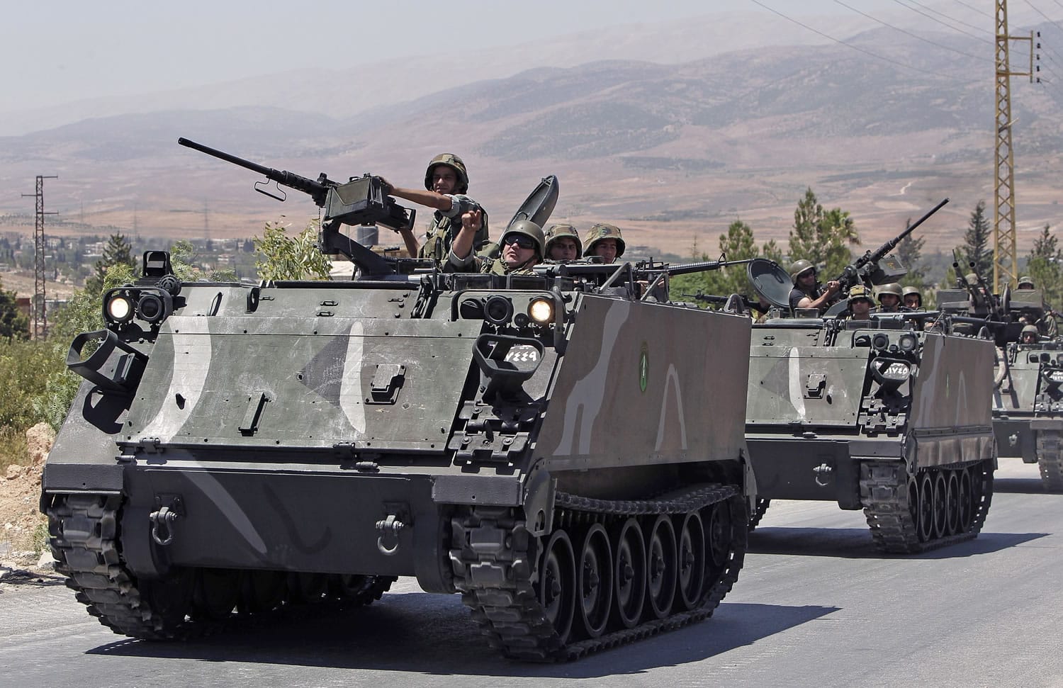 Lebanese army reinforcements arrive to the outskirts of Arsal, a predominantly Sunni Muslim town near the Syrian border in eastern Lebanon on Monday.