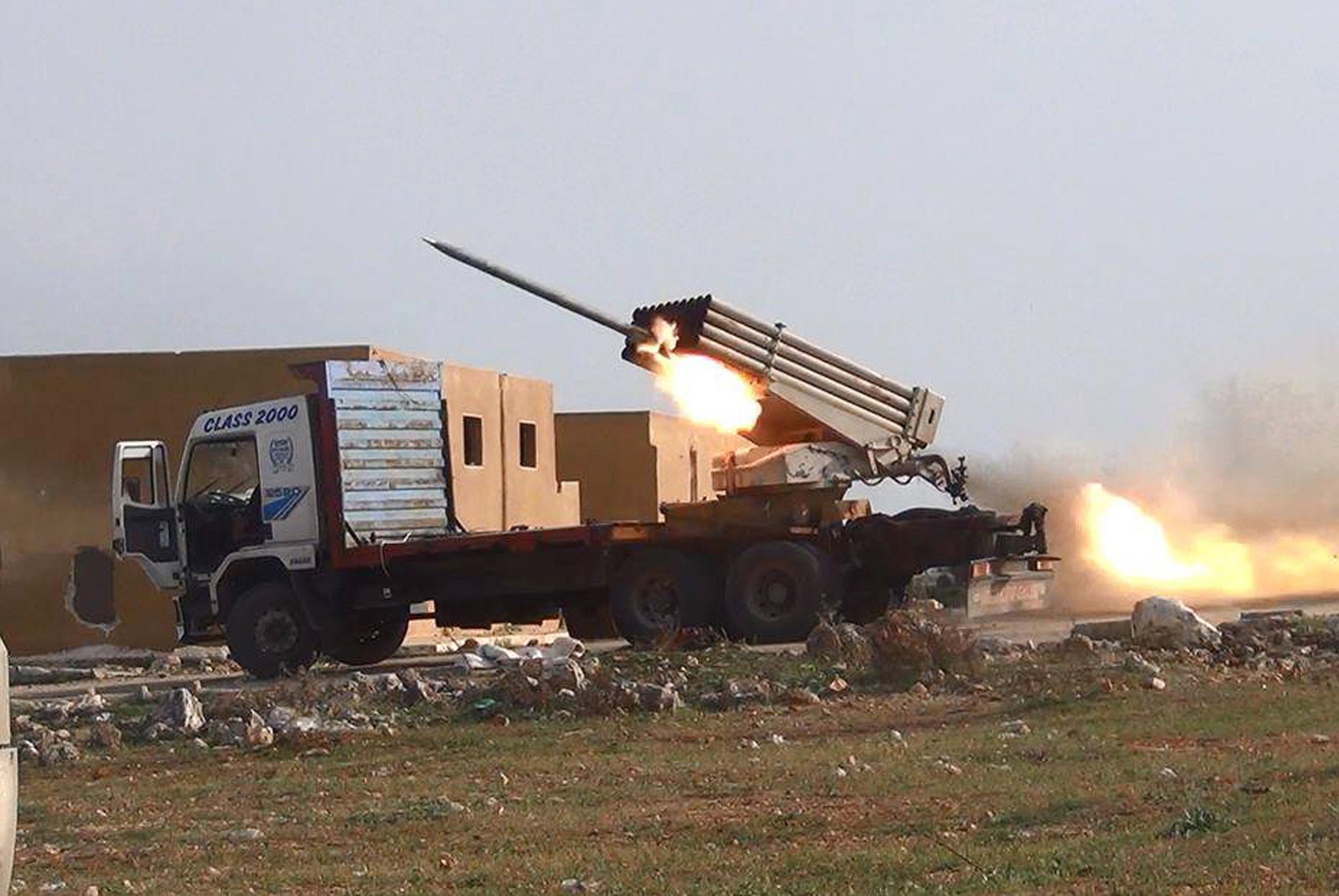 Multiple rocket launchers fire Grad missiles by the Syrian rebels April 14 as they shell the government forces positions, in Aleppo, Syria.