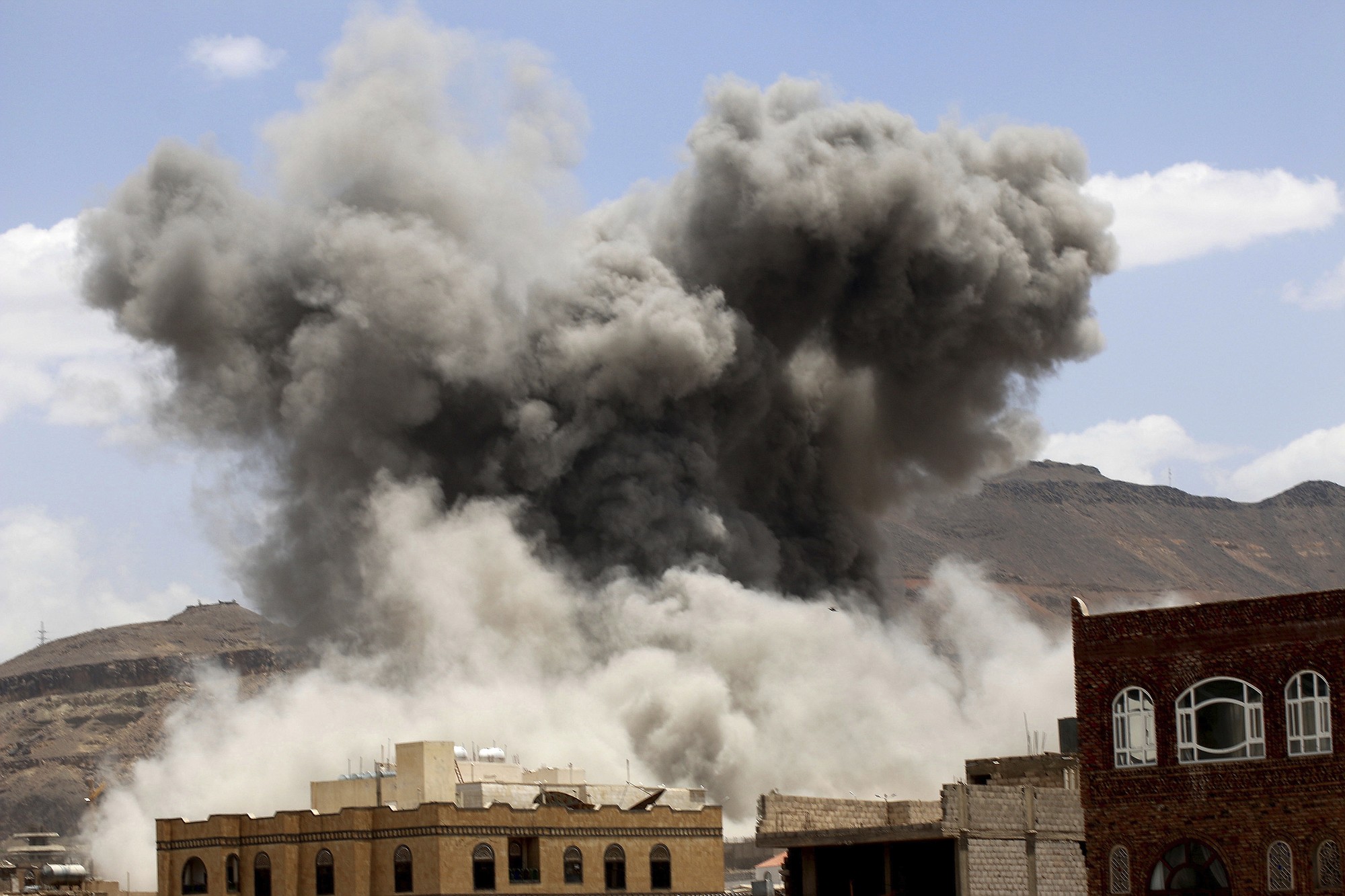 Smoke rises after a Saudi-led airstrike targeted a military base in Sanaa, Yemen, on Sunday.