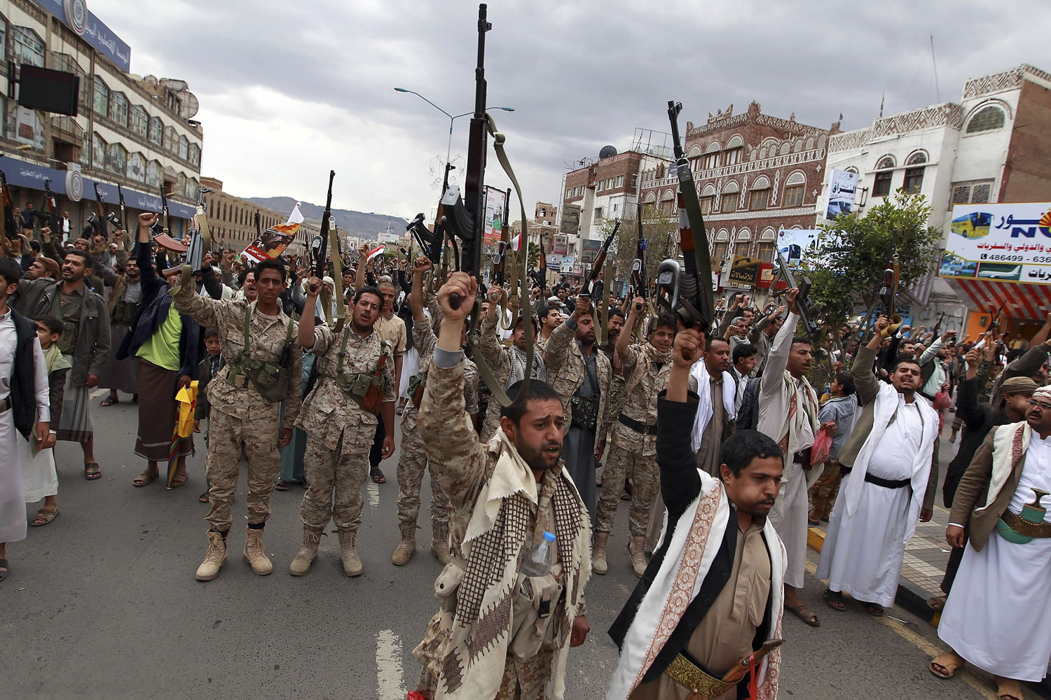 Shiite rebels, known as Houthis, hold up their weapons to protest against Saudi-led airstrikes, as they chant slogans during a rally in Sanaa, Yemen, on Thursday.