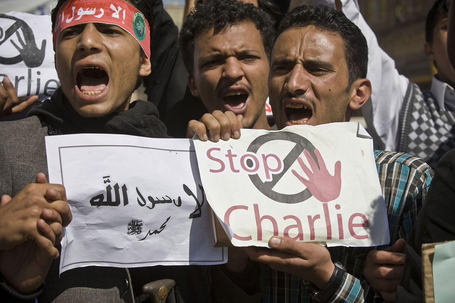 Yemenis chant slogans Saturday during a protest against caricatures published in French magazine Charlie Hebdo in front of the French Embassy in Sanaa, Yemen.