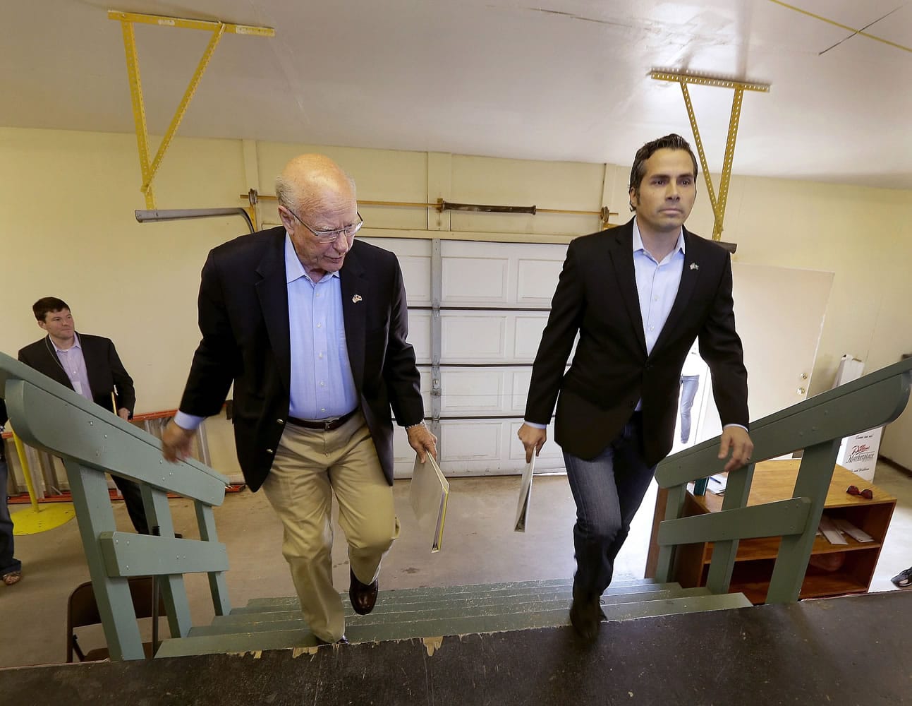 Republican Sen. Pat Roberts, left, and Greg Orman walk to the stage before a Senate debate Sept. 6, in Hutchinson, Kan. Orman, an independent candidate challenging Roberts for the U.S. Senate in Kansas, has turned a longshot independent bid into a threat to the GOP veteran.