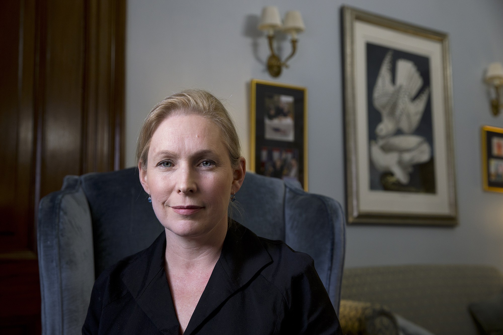 Sen. Kirsten Gillibrand, D-N.Y., poses for a portrait after speaking about military sexual assaults, during an interview in her office on Capitol Hill in Washington.   The spouses of service members and civilian women who live or work near military facilities are especially vulnerable to being sexually assaulted, Sen. Kirsten Gillibrand, D-N.Y.