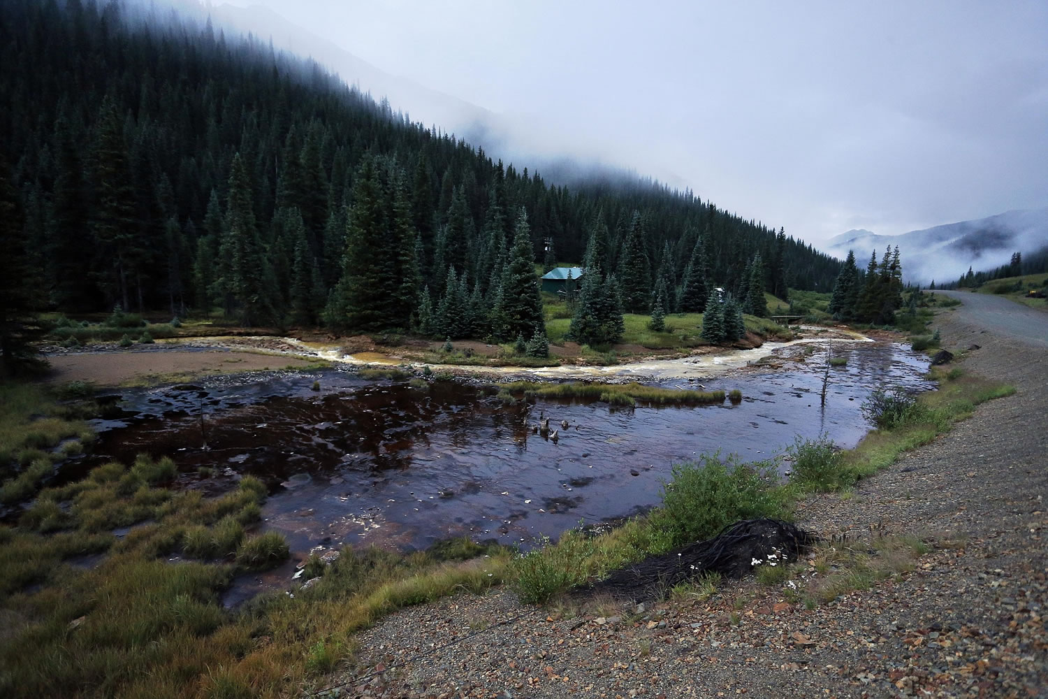 The Cement Creek flows down a valley a few miles downstream from the Gold King mine, where a wastewater accident several days earlier has raised alarm, outside Silverton, Colo., on Wednesday.
